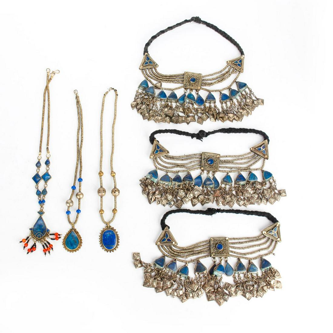 6 20TH C. AFGHAN BIB, PENDANT NECKLACES: Traditional ethnic design, w. inset lapis stones. Oxidation/patina to metal consistent with age. Issued: 20th c. Dimensions: 20"L, longest Country of Origin: Afghanistan