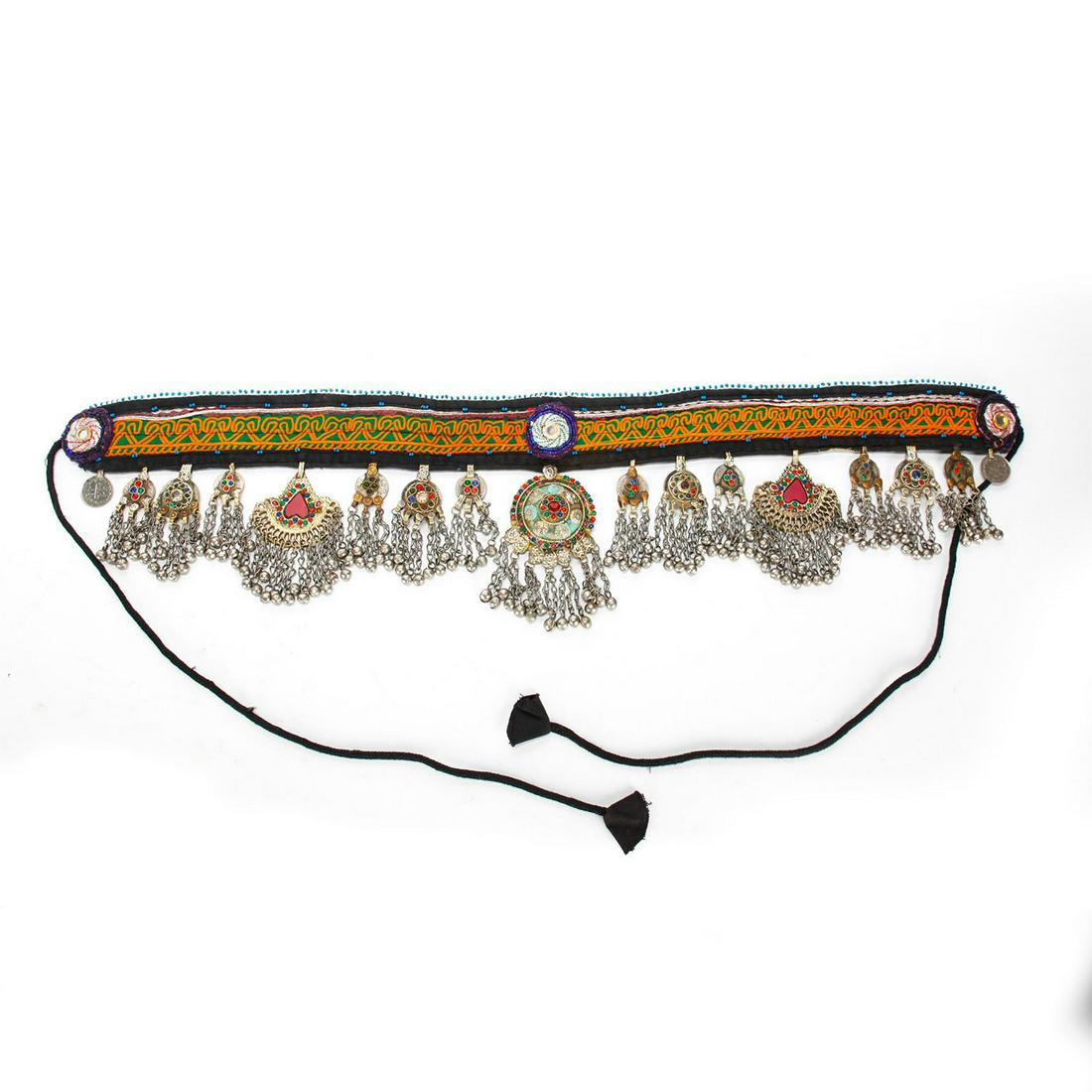 ORNATE 20TH C. KUCHI TRIBAL BELLY DANCE BELT: Embroidered fabric w. beadwork, hanging adornments, coins. Coins are of Afghani and Pakistani origin. Belt is missing a few inset beads on adornments. Issued: 20th c. Dimensions: 72"L, overall Country