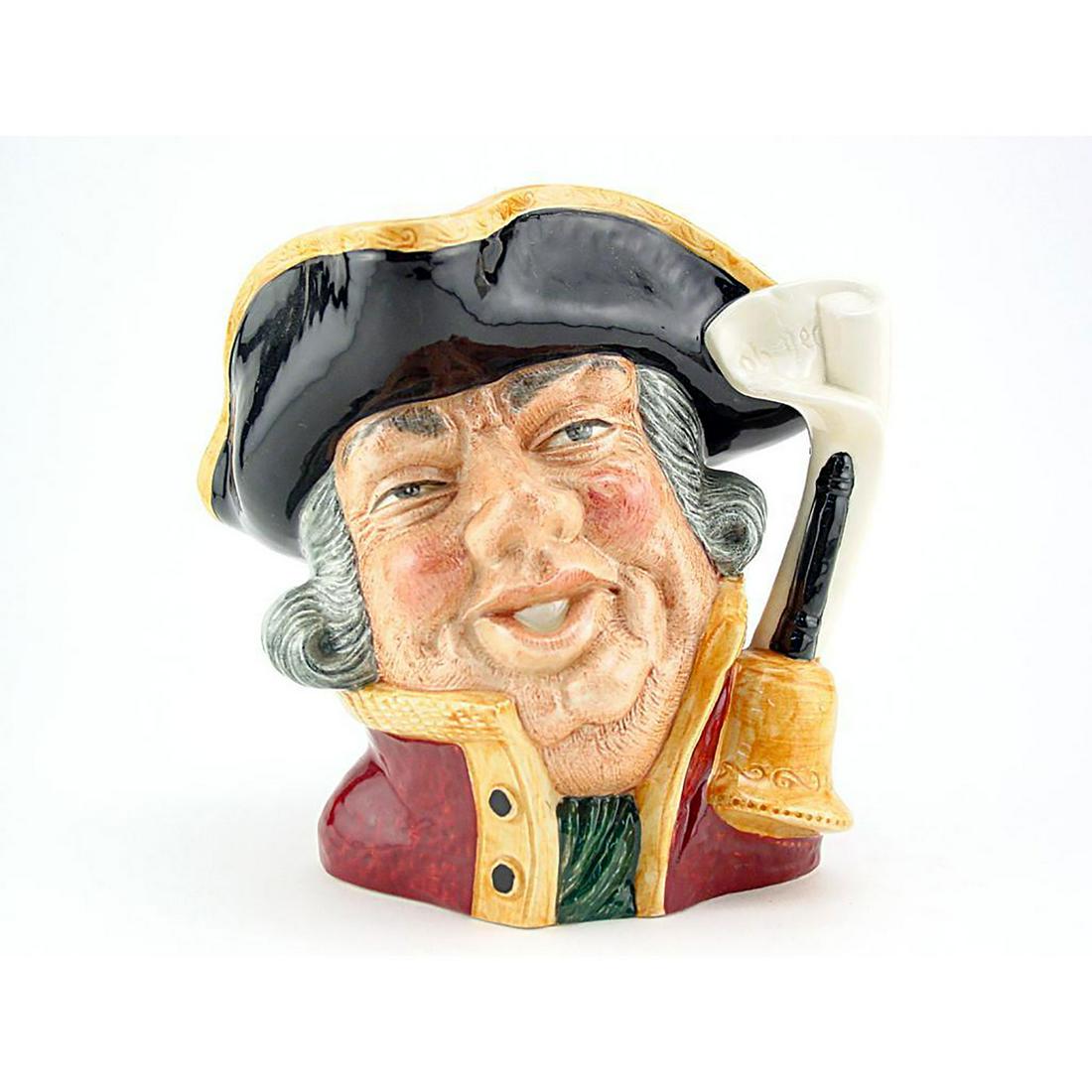 TOWN CRIER D6537 - SMALL - ROYAL DOULTON CHARACTER JUG: Town Crier D6537 (black hat trimmed with gold; scarlet coat trimmed with gold ). Designed by David B. Biggs, issued 1960 - 1974. Size: 3.25"H (Small) Manufacturer: Royal Doulton Country of Origin: Eng