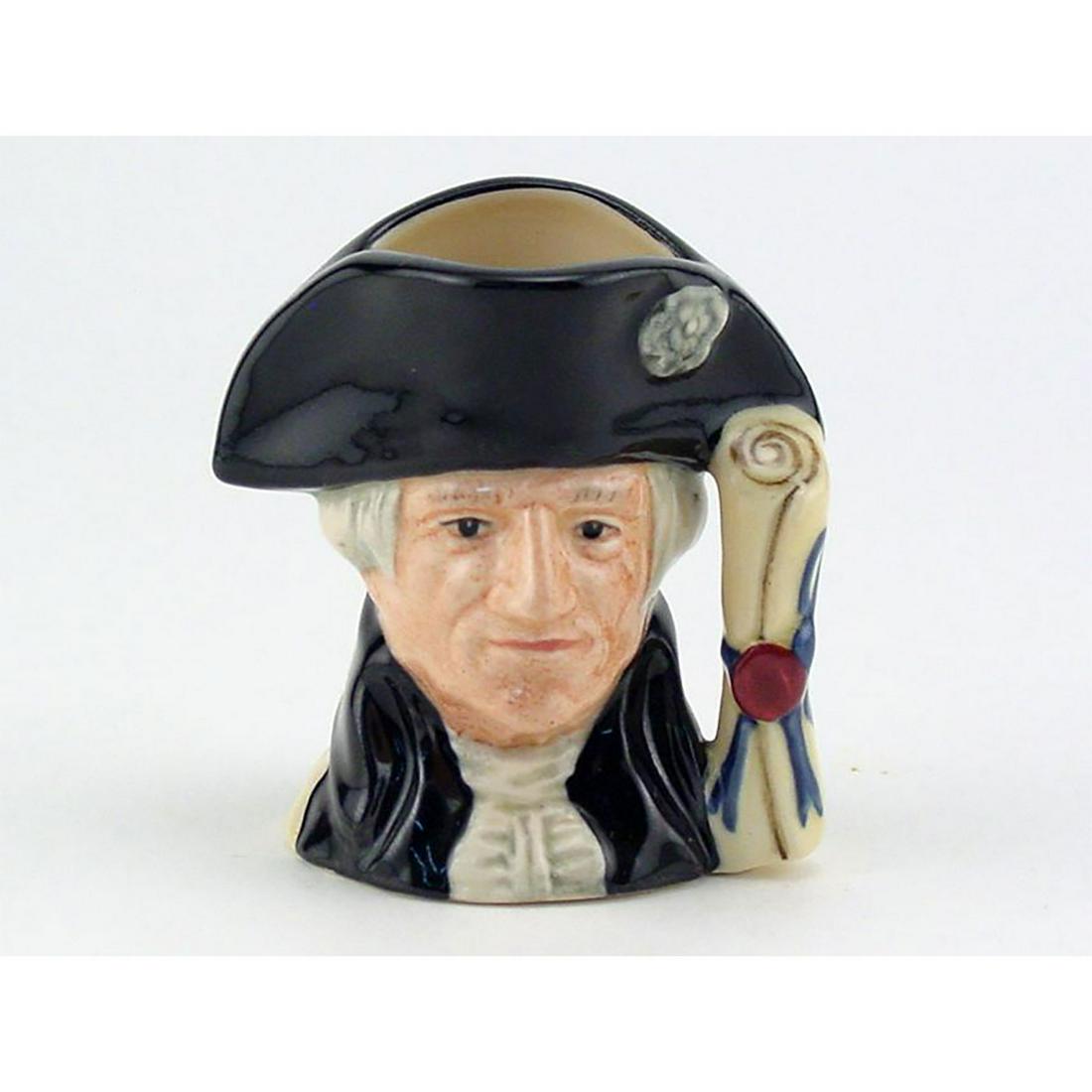 GEORGE WASHINGTON D6825 - MINI - ROYAL DOULTON: Royal Doulton Character Jug, George Washington D6825 (black hat and coat; beige shirt). Designed by Stanley J. Taylor, issued 1989- 1994. Size: 2.5"H (mini)As commander-in-chief of the American States