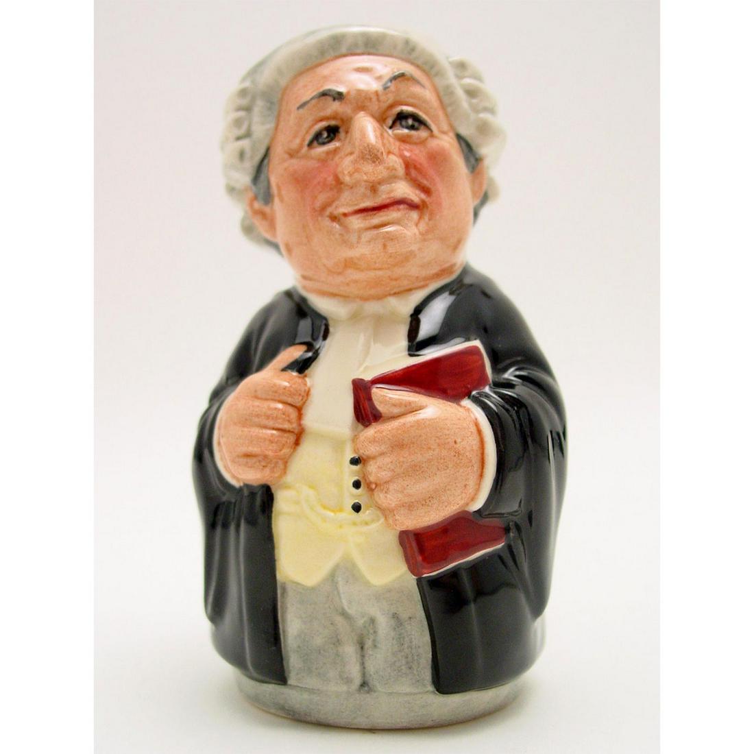 MR. LITIGATE THE LAWYER D6699 - ROYAL DOULTON TOBY JUG: The Doultonville Collection. Black robes; yellow waistcoat; grey wig and trousers. Artist: William K. Harper Issued: 1983-1991 Dimensions: 4"H Manufacturer: Royal Doulton Country of Origin: England