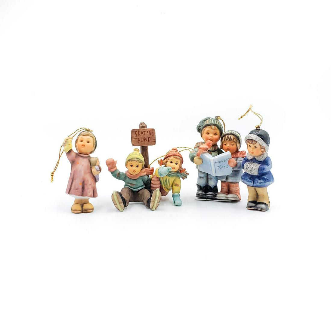 4 GOEBEL HUMMEL CHRISTMAS ORNAMENTS: Features children figures with gold string attached. Goebel backstamp. Issued: 20th c. Dimensions: 3"H, tallest Manufacturer: Goebel Country of Origin: Germany