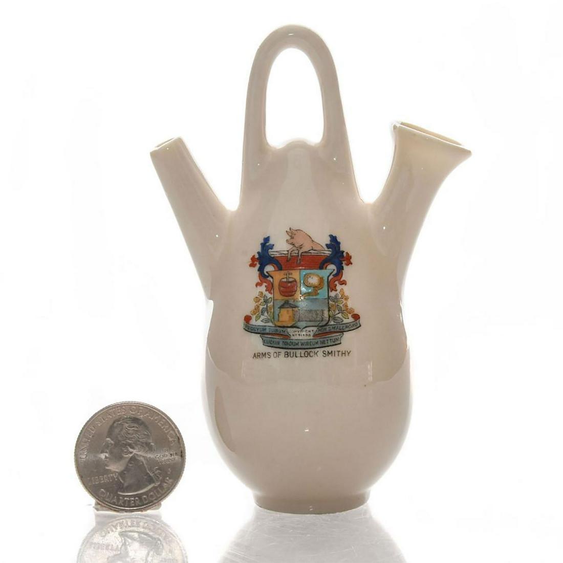 GRAFTON CRESTED HERALDIC CHINA EWER, BULLOCK SMITHY: Glazed white china ewer. Bullock Smithy coat of arms on front. Grafton China stamp on bottom. Dimensions: 4.25"H Manufacturer: Grafton China Country of Origin: England
