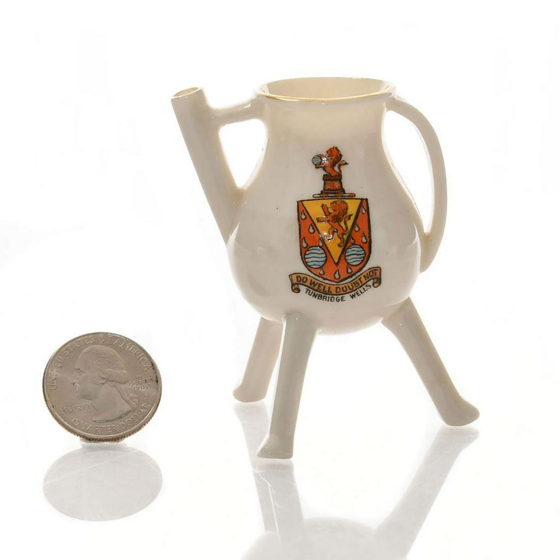 W.H. GOSS MINIATURE CRESTED KETTLE, TUNBRIDGE WELLS: Marked DO WELL DOUBT NOT TUNBRIDGE WELLS. Handpainted Tunbridge Wells coat of arms. W.H. Goss backstamp. Issued: c. 1930 Dimensions: 2.75"H Manufacturer: W. H. Goss Country of Origin: England