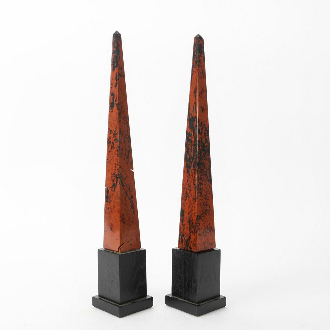 2 OBSIDIAN POINT MAHOGANY DECORATIVE OBELISKS: Deep colored Obelisk on wooden base. Total weight 2.7 lbs. One has cracking to obelisk. A gift of Marilyn Alsdorf.Â Dimensions: 20"H Provenance: Collection of John R. Lanzendorf Provenance: Collecti