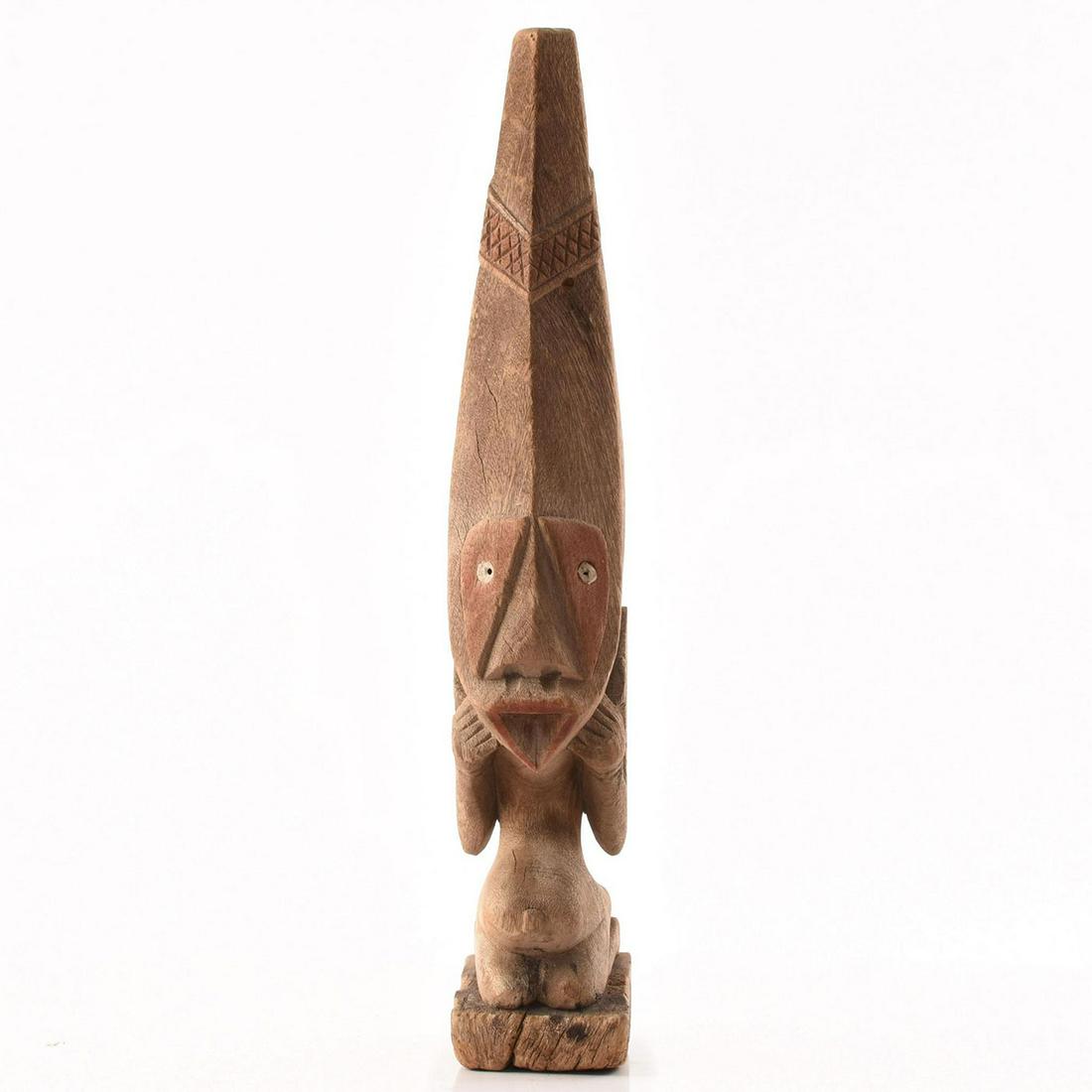 WOODEN TRIBAL FIGURE KNEELING WEARING MASK: Wooden figure kneeling wearing elongated mask. Issued: 20th c. Dimensions: 18"H Provenance: David Farin Collection
