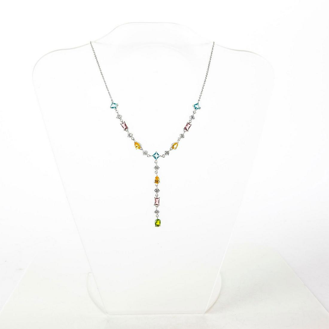 STERLING SILVER NECKLACE W. SEMI PRECIOUS STONES: Inset citrine, amethyst, topaz, olivine, cubic zirconia. Stamped 925. Total weight is approximately 10g. Issued: Late 20th - Early 21st c. Dimensions: 16"L Provenance: David Farin Collection