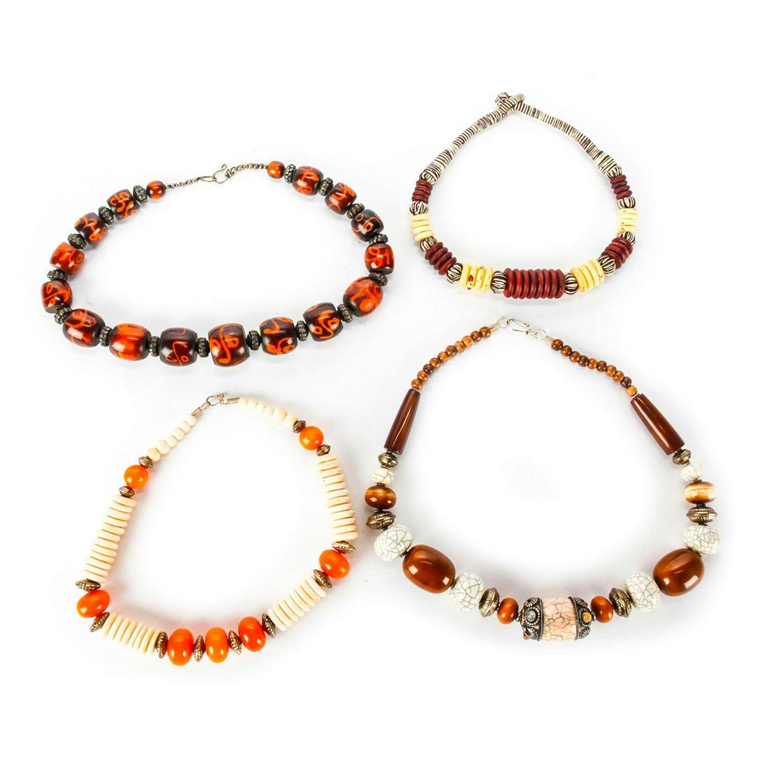 4 20TH C. TIBETAN LARGE BEAD NECKLACES: Beads in colors of off white, amber, brown. Issued: 20th c. Dimensions: 24"L, longest Country of Origin: China Provenance: David Farin Collection