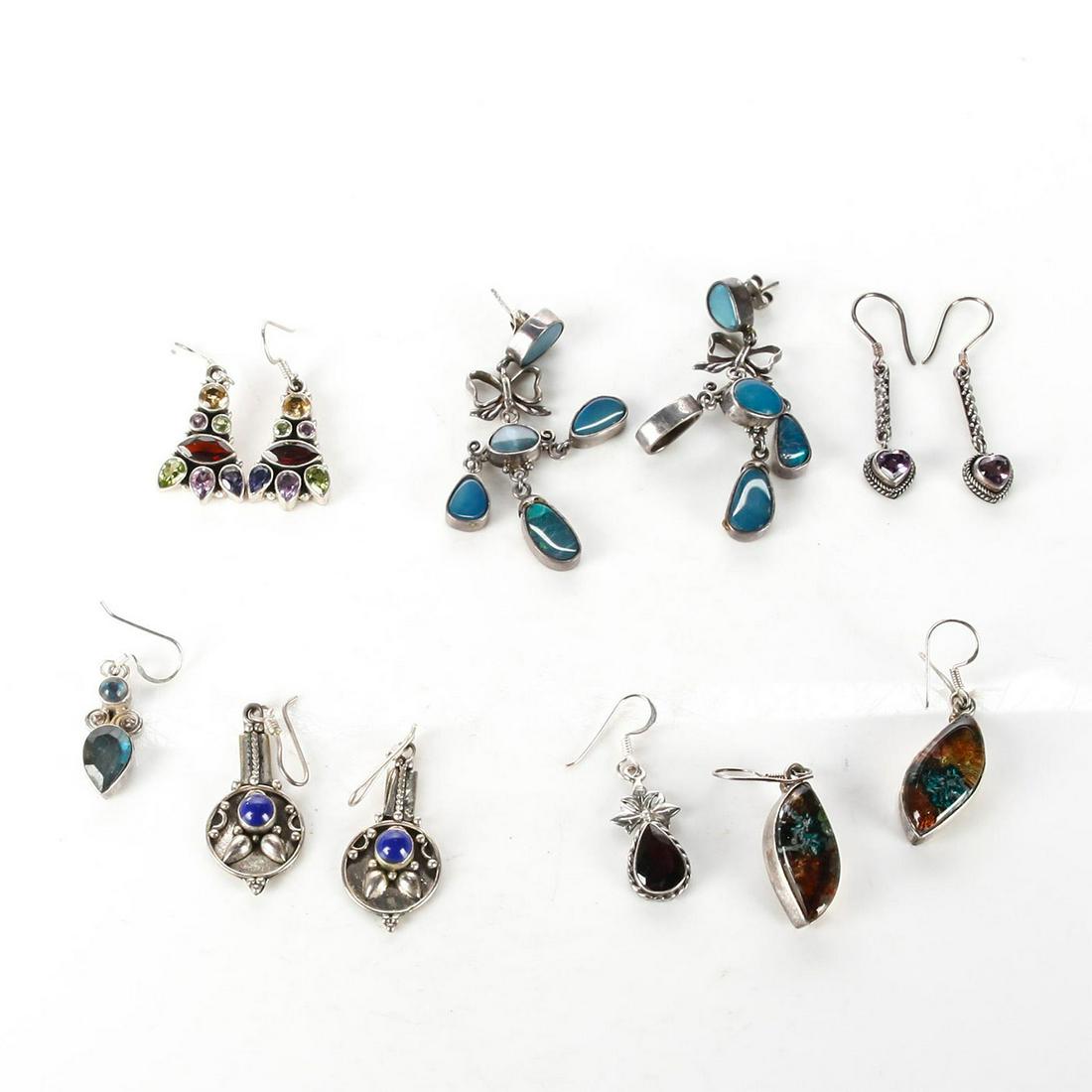 6 PAIR STERLING SILVER EARRINGS W. SEMI PRECIOUS STONES: Inset w. amethyst, citrine, peridot, dichromatic glass, lapis. Each stamped 925. Total weight is approximately 50.8g. Issued: 20th c. Dimensions: 2"H, largest Provenance: David Farin Collection