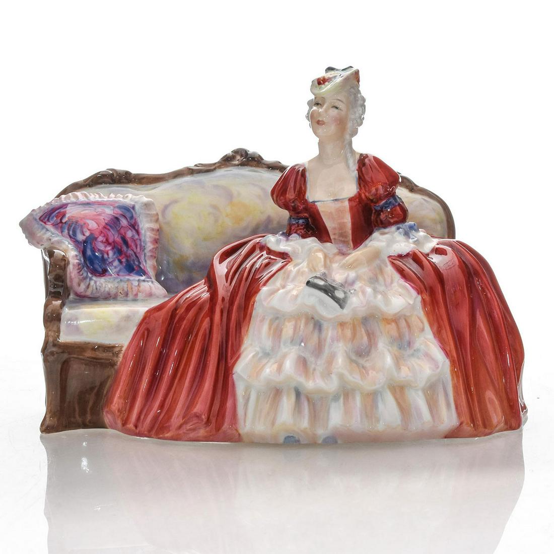 BELLE O' THE BALL HN1997 - ROYAL DOULTON FIGURINE: Part of the Dance Theme series. Sitting pretty on her 19th century couch, she is truly the Belle of the Ball in her gorgeous red dress. Handpainted HN. Royal Doulton backstamp. Artist: R. Asplin Issue