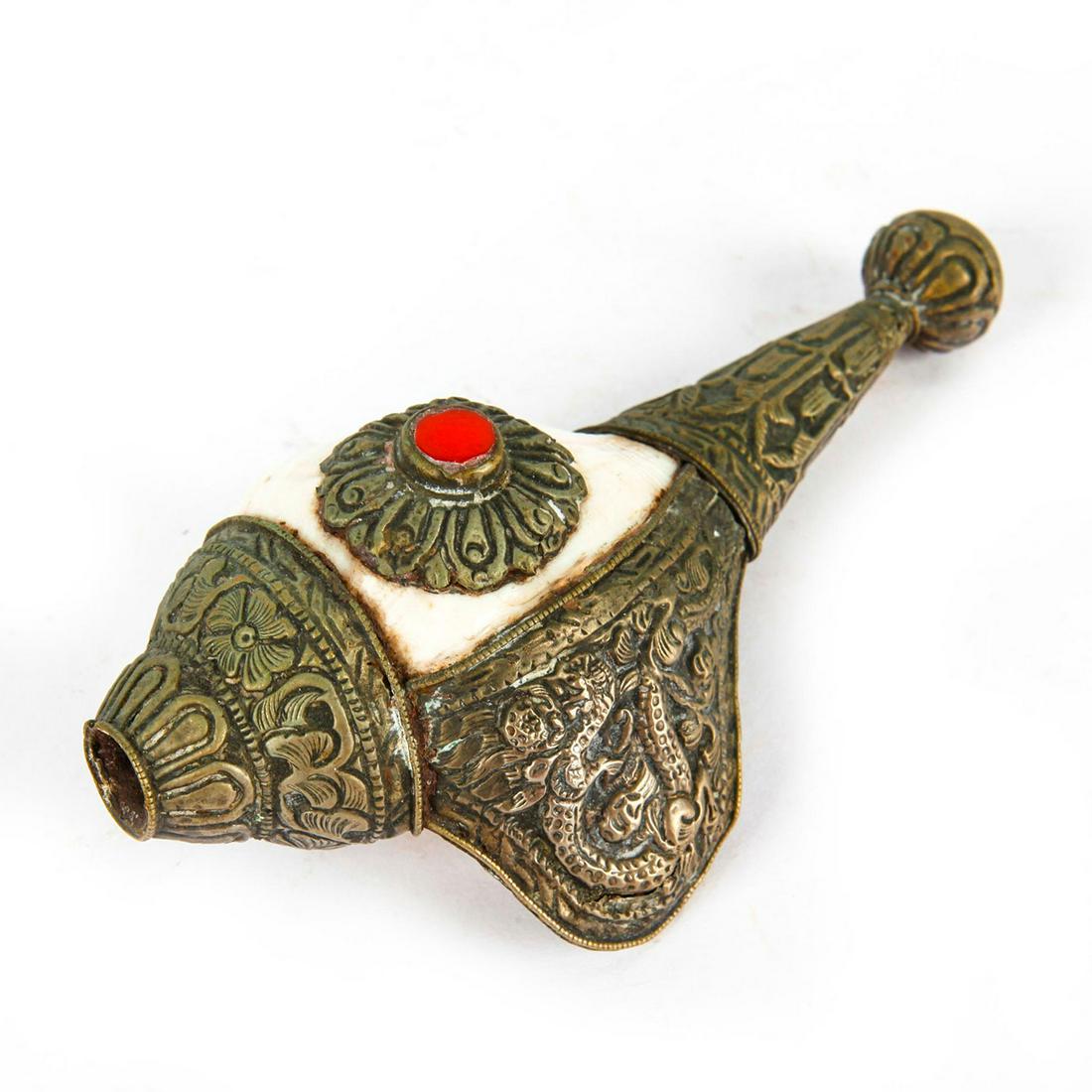 DECORATIVE SEASHELL WITH BRONZE: Encased in carved bronze with a dragon and floral patterns. Embellished with a single red stone. Issued: 20th c. Dimensions: 6"H Provenance: David Farin Collection