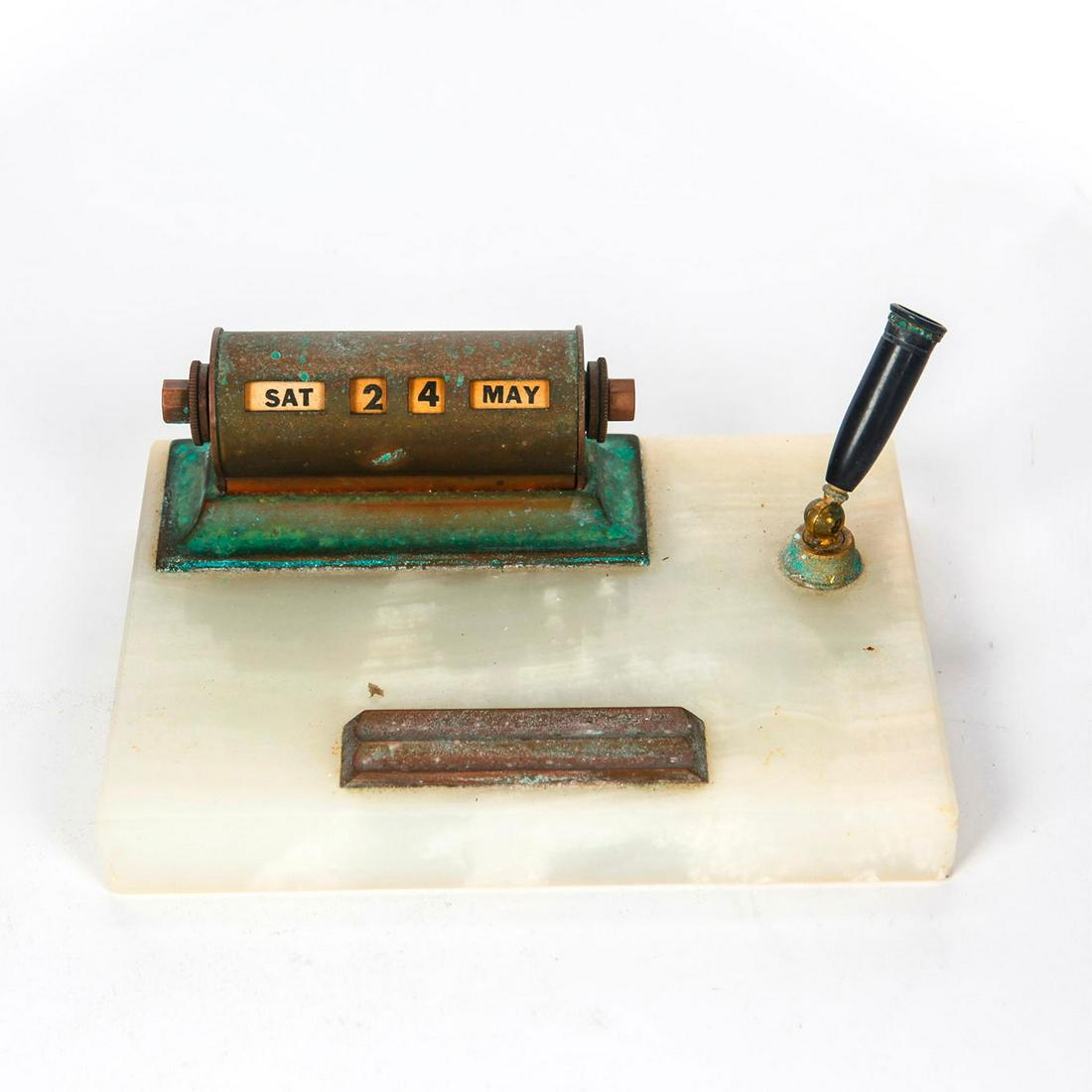 MARBLE AND COPPER DESK CALENDAR AND PEN HOLDER: Day, date, month calendar. Heavy patina. Issued: Early - Mid 20th c. Dimensions: 7"L x 5"D x 2.75"H