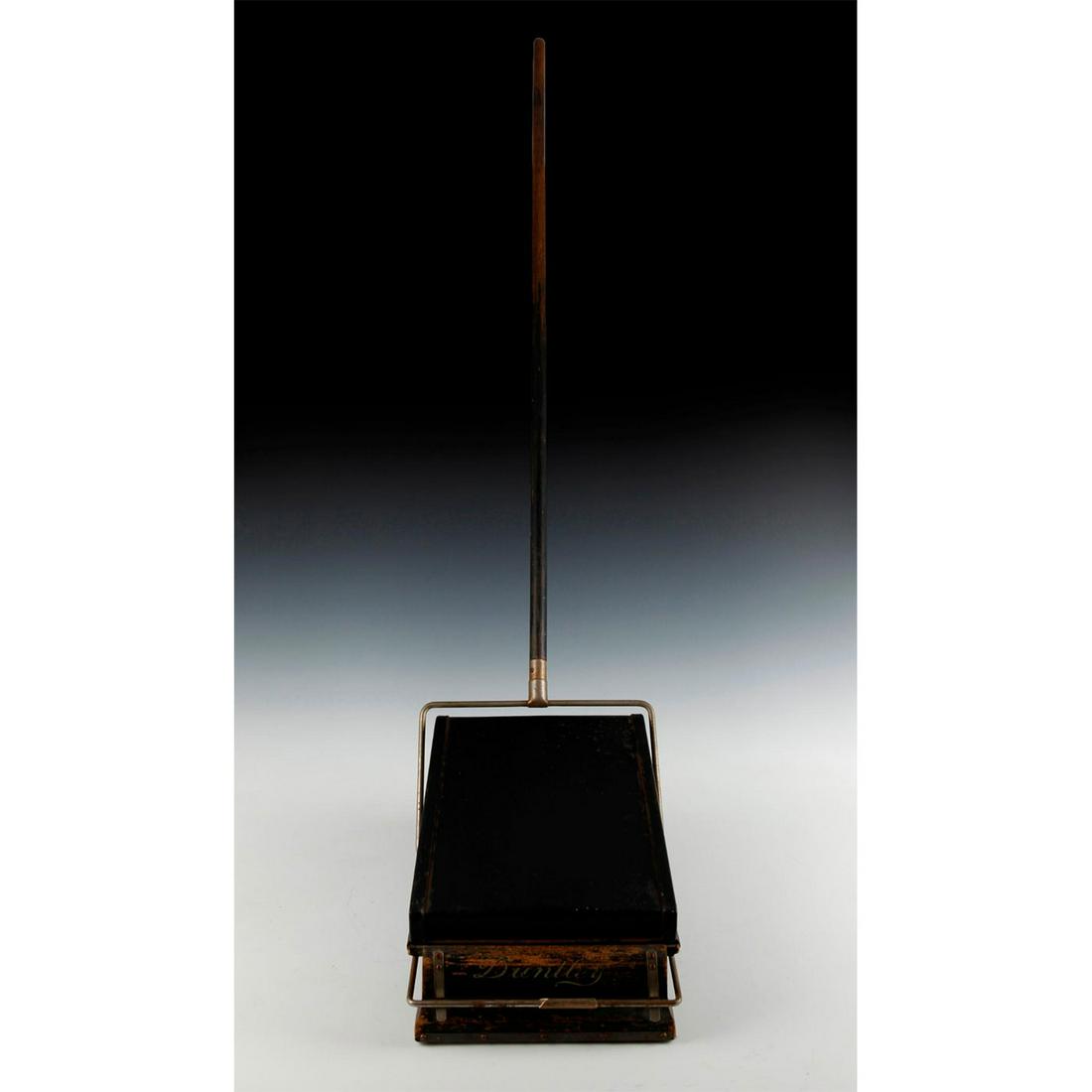 ANTIQUE CARPET SWEEPER VACUUM CLEANER: Metal cabinet with wood, metal brackets. Manufacturer label. Antique Duntley Pneumatic Sweeper carpet sweeper, wheeled bellows combination sweeper and vacuum. Original manufacturer label affixed to wo