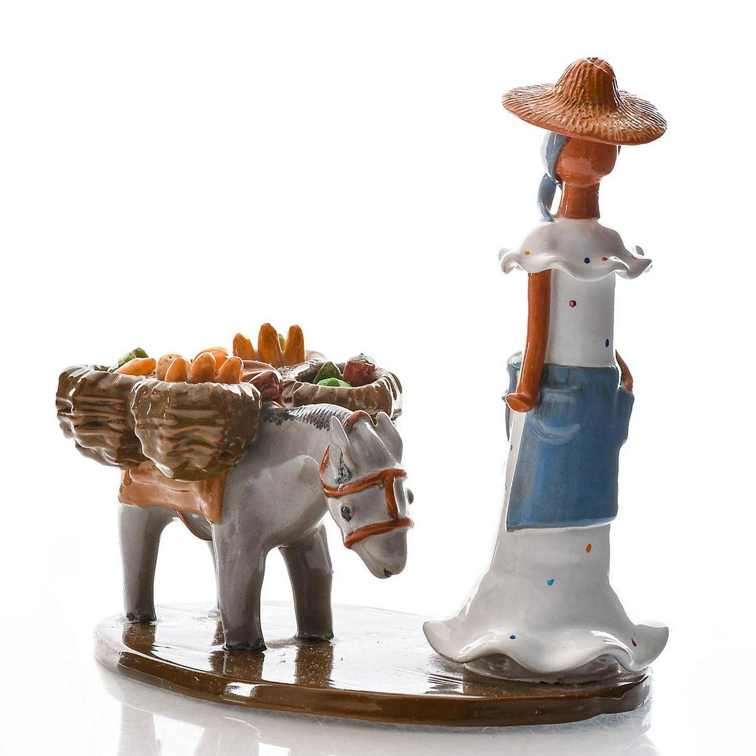 LIME FACELESS DOMINICAN REPUBLIC TABLEAU, MARCHANTA: Depicts woman with donkey carrying fruits and vegetables. Clay pottery faceless doll figure by Lilliana Mera. She created faceless dolls because she feel Dominican people represent a variety of ethnic