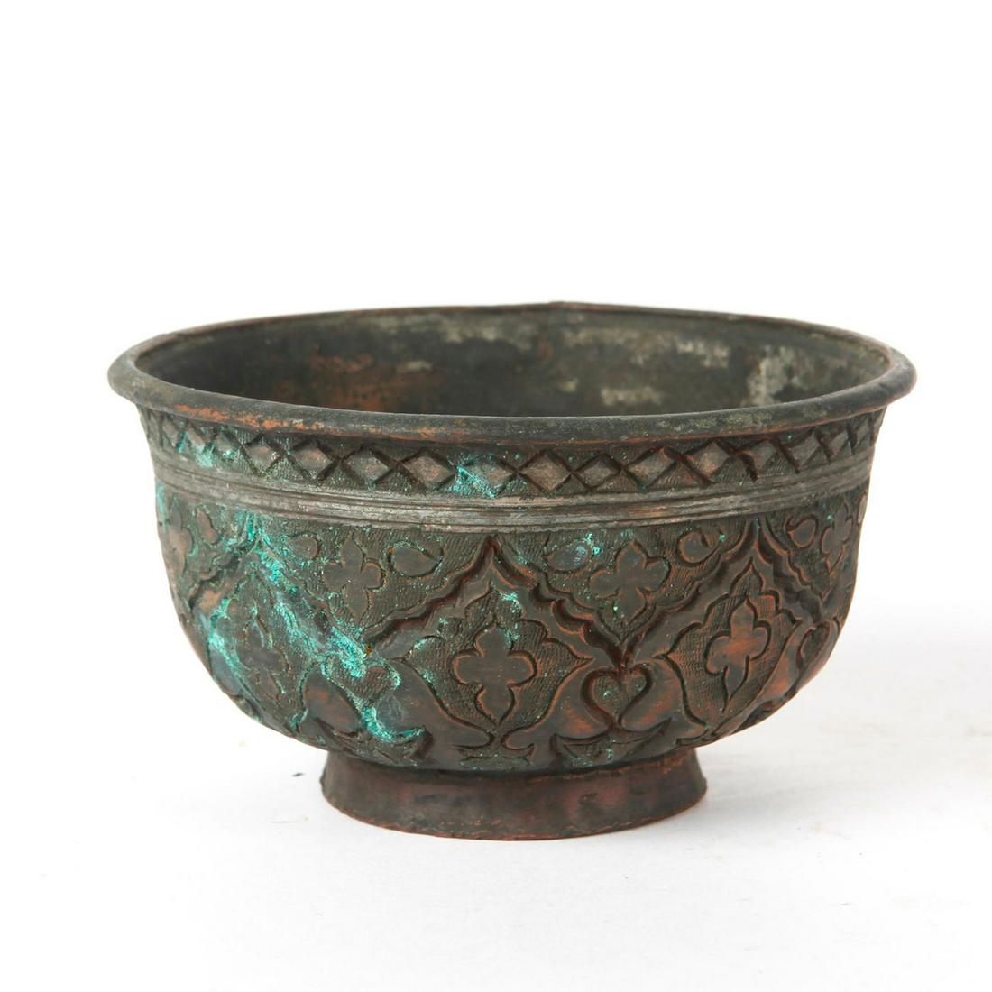 BRONZE BOWL WITH INTRICATE ETCHED DESIGN: Beautifully decorated bronze bowl with a few spots of verdigris. Small crack on top edge. Issued: 19th c. Dimensions: 2.5" Provenance: David Farin Collection