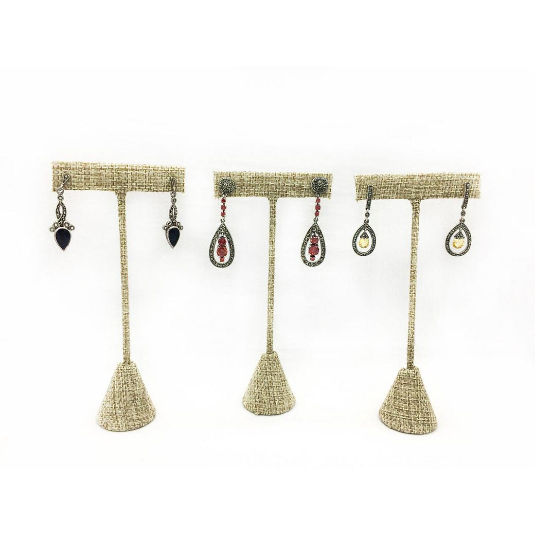 3 PAIRS STERLING SILVER MARCASITE EARRINGS: Beautiful marcasite earrings with stones. All are stamped 925. The lengths are 2"L, 1.5"L and just over 1.5"L. The total weight of all three is 19.8g. Issued: 20th c. Provenance: David Farin Collectio