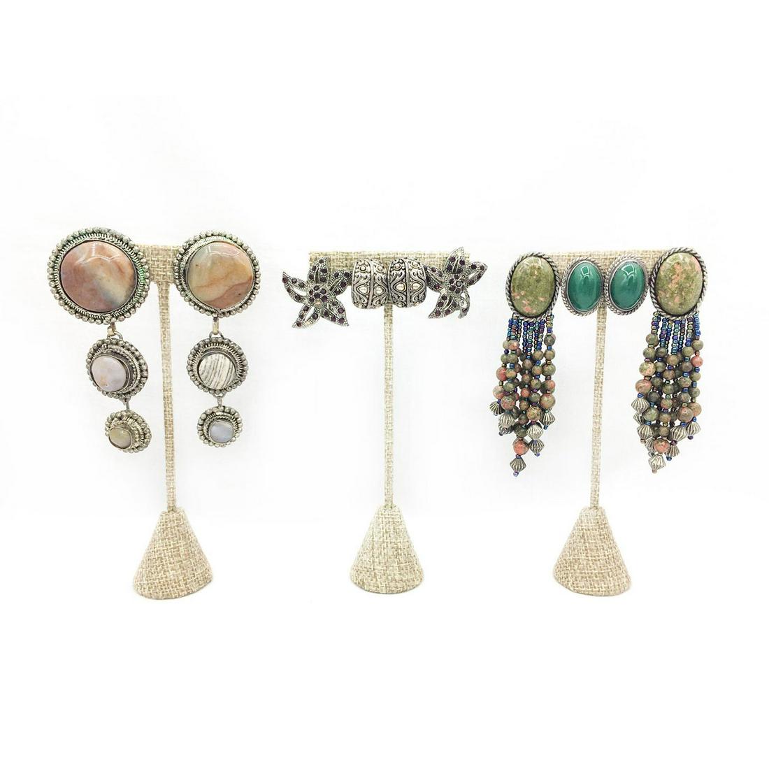 5 PAIRS VINTAGE CLIP ON EARRINGS, STONES, RHINESTONES: Diverse styles of earrings with stones, beads, rhinestones. Earrings are 3.25"L, 2.25"L, 2"L, 1.75"L, 1.25"L, 1"L. Issued: 20th c. Provenance: David Farin Collection