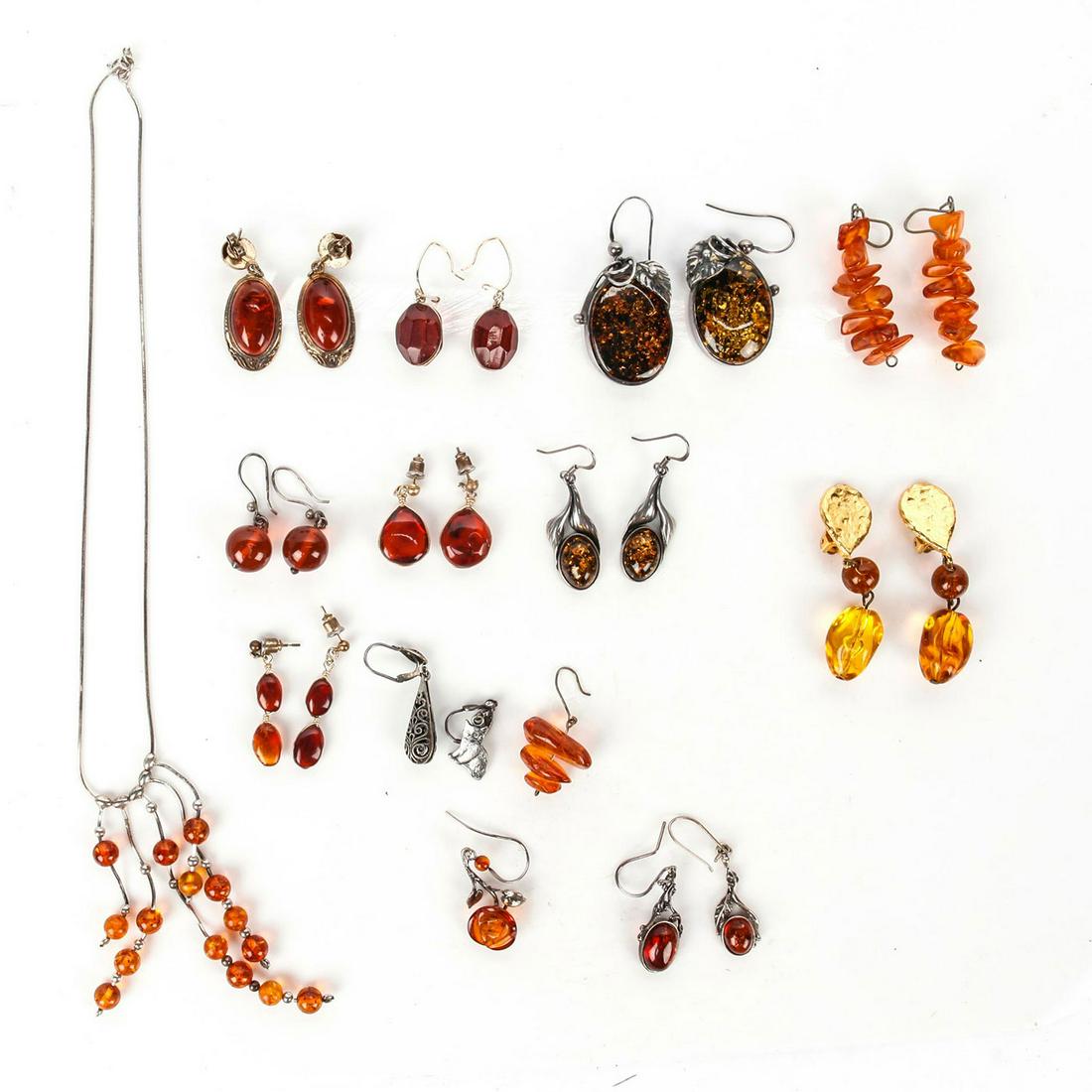 9 EARRINGS WITH NATURAL AMBER STONE: 9 different styled earrings. Total weight 88g. Issued: 20th c. Dimensions: Total weight 88g. Provenance: David Farin Collection