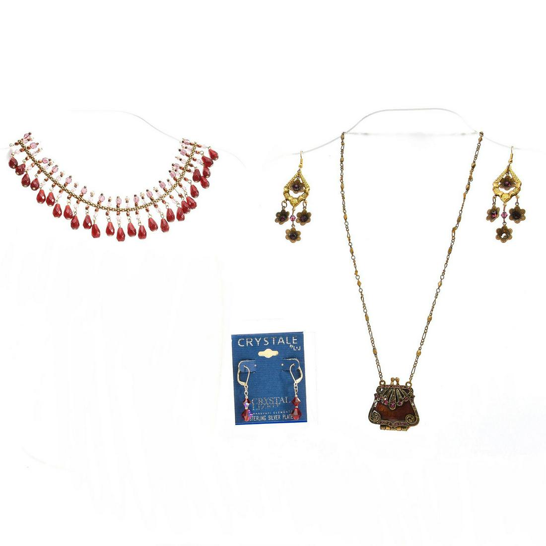 WINE RED TEAR DROP STATEMENT WITH LOCKET NECKLACE: 2 necklaces and 2 earrings. Total weight 83g. Necklace sizes 16", 18". Issued: 20th c. Dimensions: Total weight 83g. Provenance: David Farin Collection