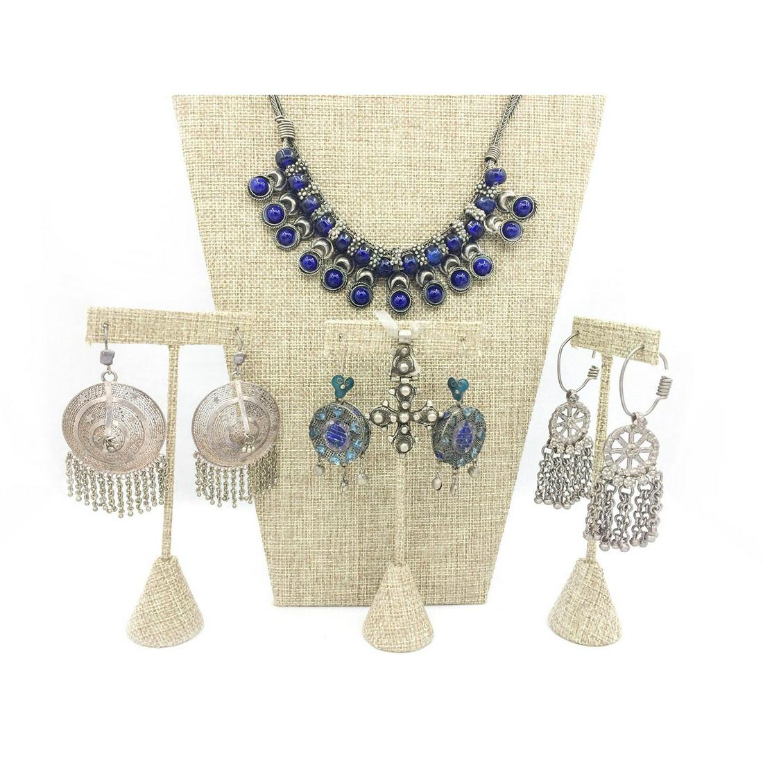 INDIAN JEWELRY, 3 PAIRS EARRINGS, NECKLACE AND PENDANT: Necklace with sapphire color stones. Earrings with tassel beads. Pendant is 2.25"L. Earrings are 3.5"L, 3.25"L and 2.5"L. The necklace length from center clasp to bottom of pendant is 9"L. Issued: 20t