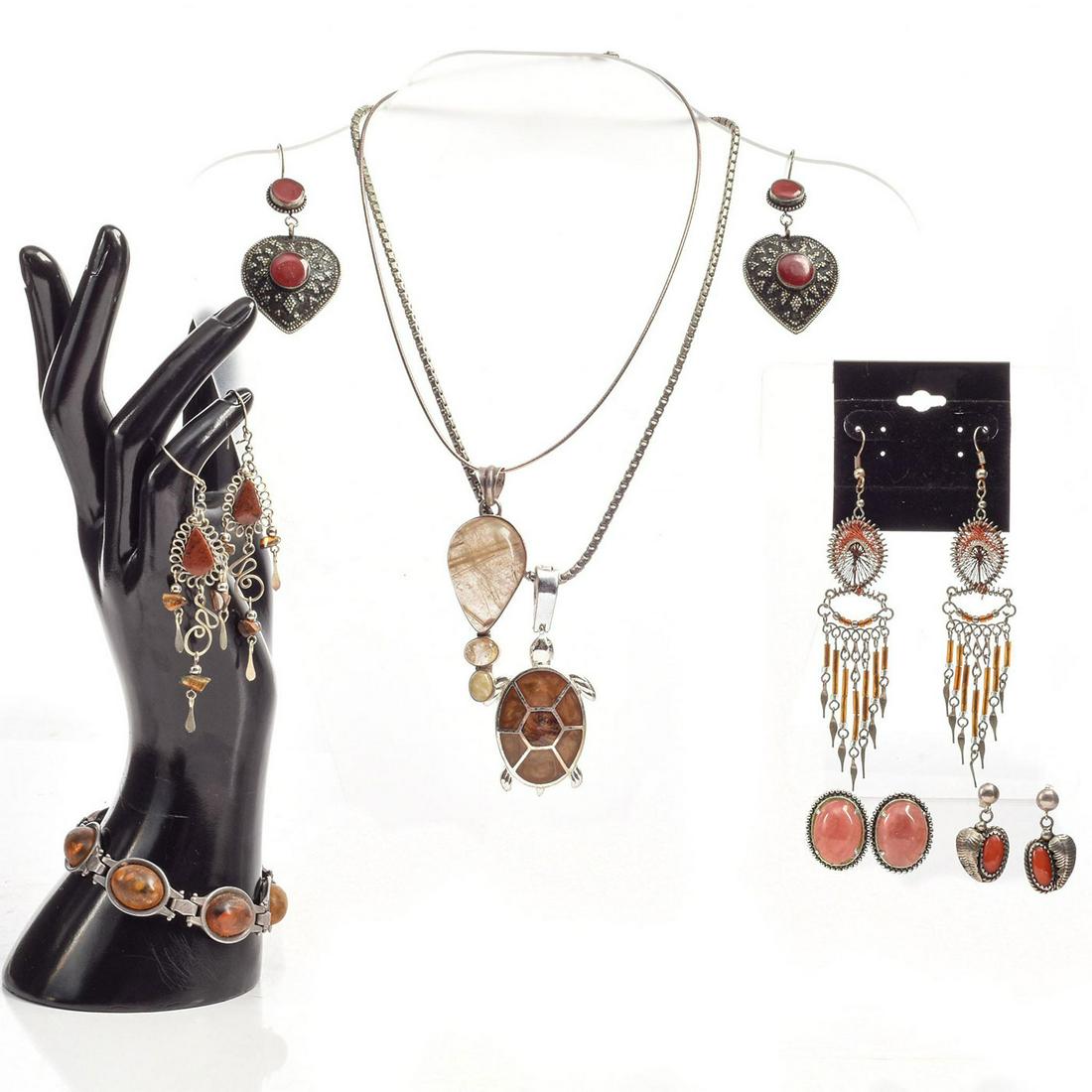 SMOKY QUARTZ NATURAL STONED JEWELRY: 2 necklaces, 1 bracelet, and 4 earrings. Total weight 123g. Necklace sizes 14", 16", bracelet size 7". Issued: 20th c. Dimensions: Total weight 123g. Provenance: David Farin Collection