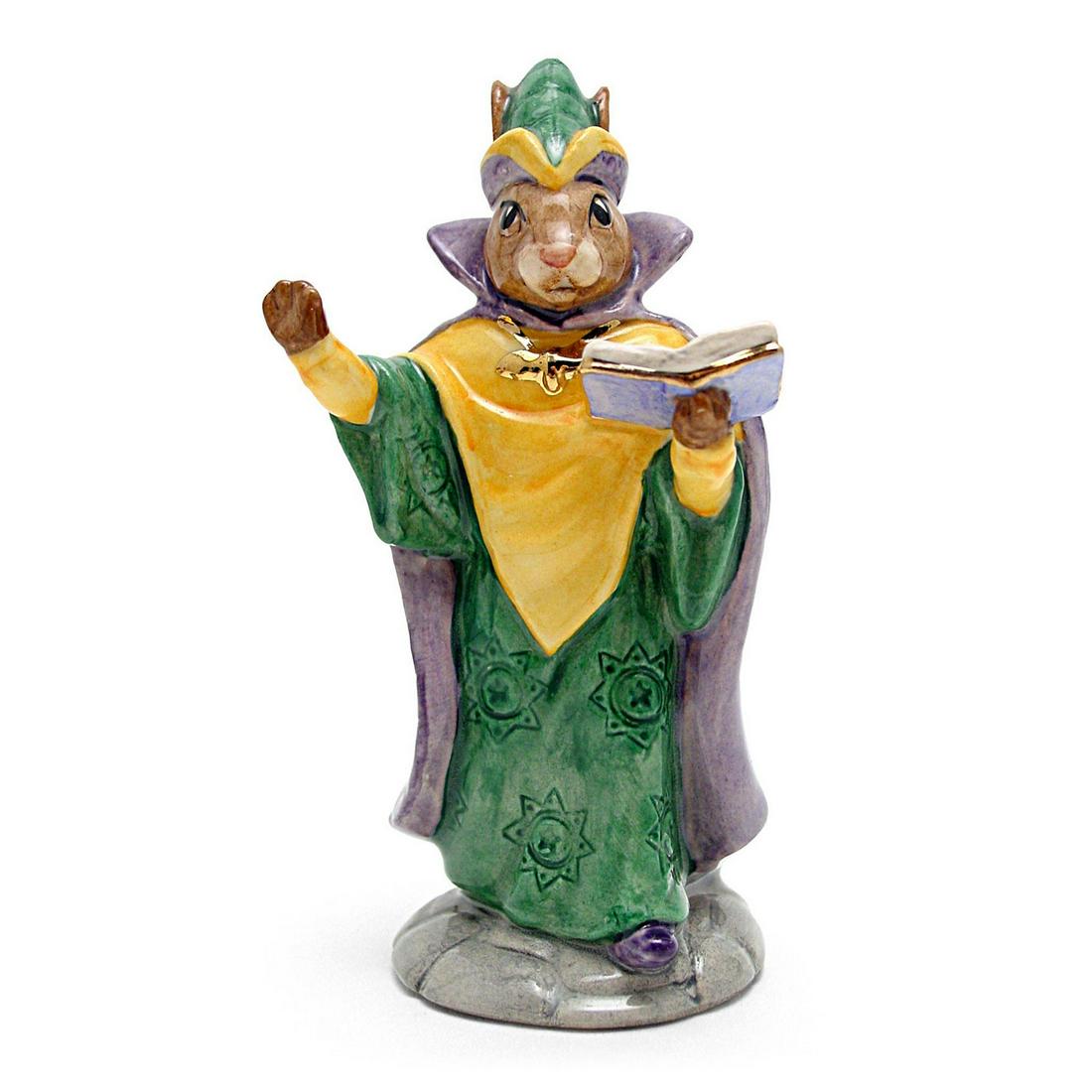 MYSTIC DB197 - ROYAL DOULTON BUNNYKINS: Royal Doulton Bunnykins, Mystic Bunnykins DB197 (Gold, green and purple robes and cap). Designed by Martyn Alcock, issued July to December 1999. Size 4.75"H Artist: M. Alcock Issued: 1999 Dimensions: 