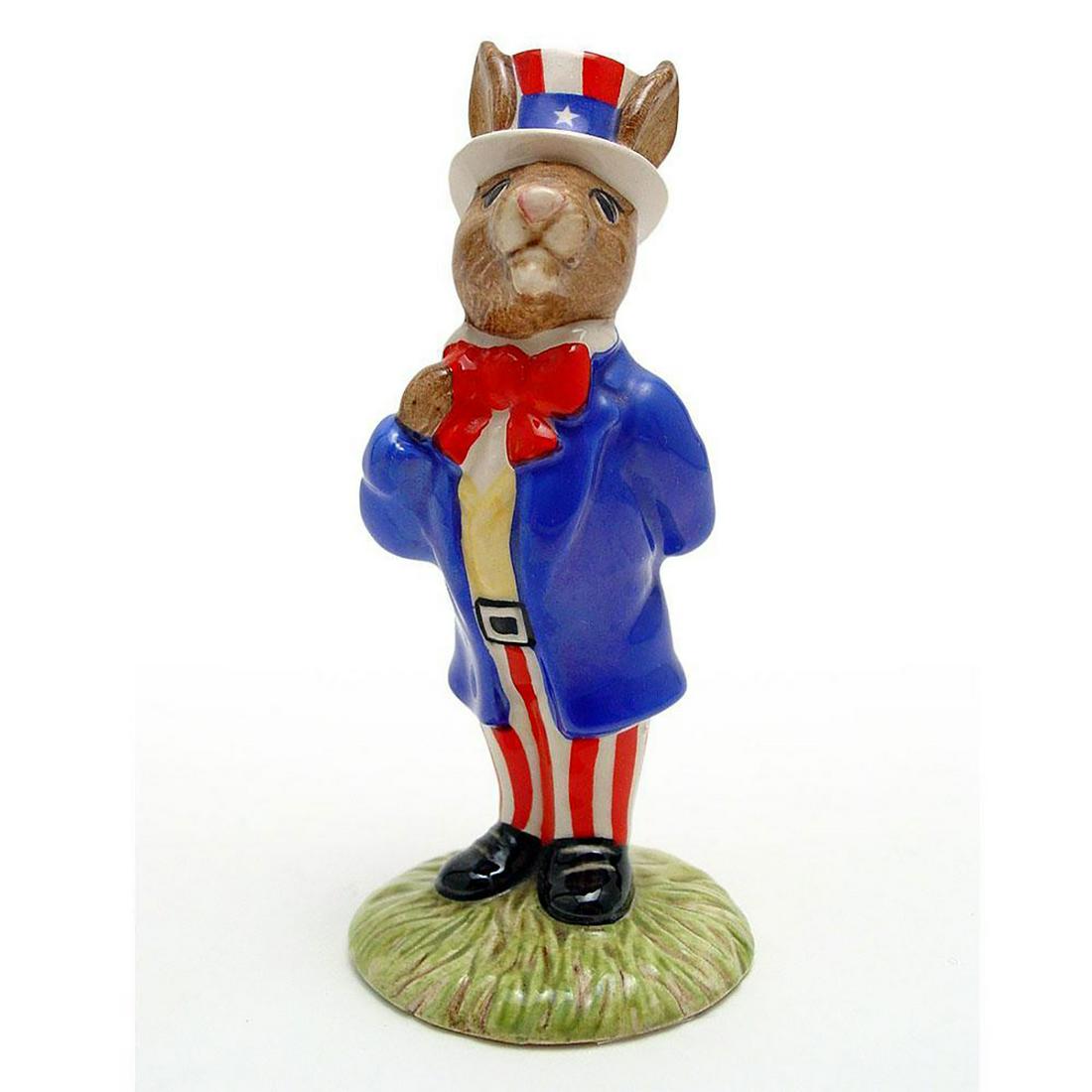 UNCLE SAM DB50 - ROYAL DOULTON BUNNYKINS: Blue, red and white coloration. Includes original box. Royal Doulton backstamp. Artist: H. Sales Issued: 1986 - 2001 Dimensions: 4.5"H Manufacturer: Royal Doulton Country of Origin: England