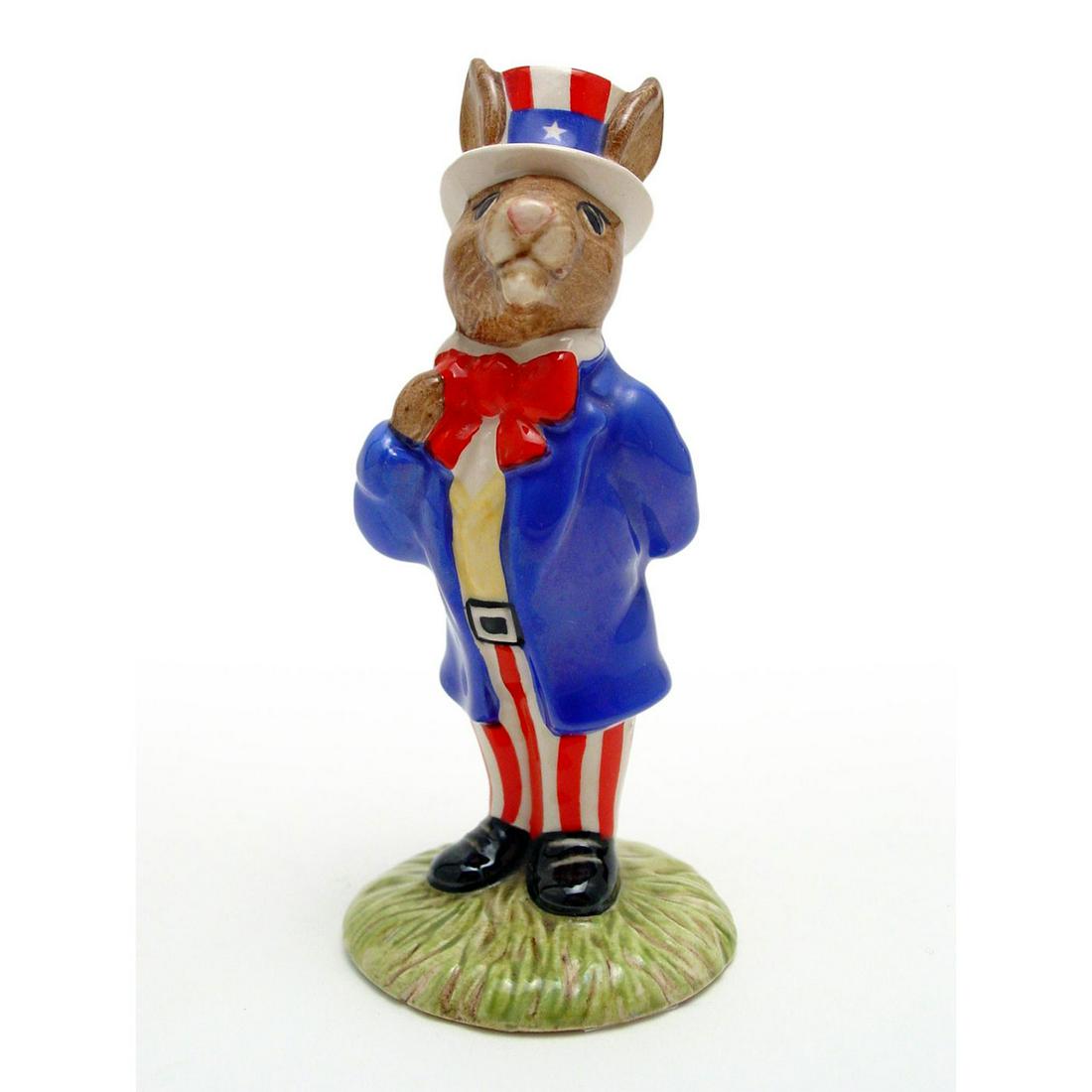 UNCLE SAM DB50 - ROYAL DOULTON BUNNYKINS: Blue, red and white coloration. Includes original box. Royal Doulton backstamp. Artist: H. Sales Issued: 1986 - 2001 Dimensions: 4.5"H Manufacturer: Royal Doulton Country of Origin: England