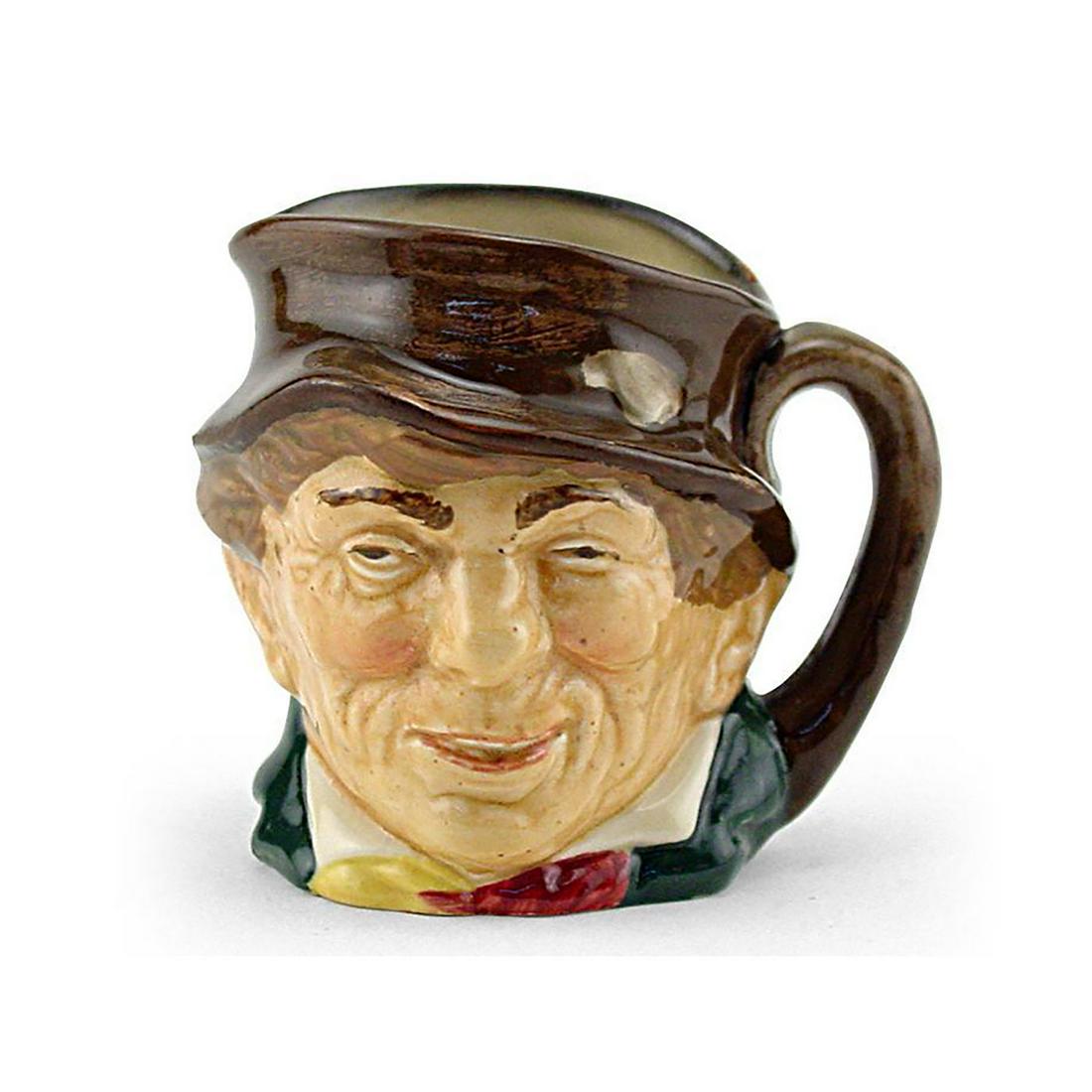 PADDY D5753 - LARGE - ROYAL DOULTON CHARACTER JUG: Paddy D5753 (brown hat; green coat; yellow and red scarf). Designed by Harry Fenton, issued 1937 - 1960. Size: 6"H (Large)Paddy, a colloquial term for an Irishman, is derived from St. Patrick, the cou
