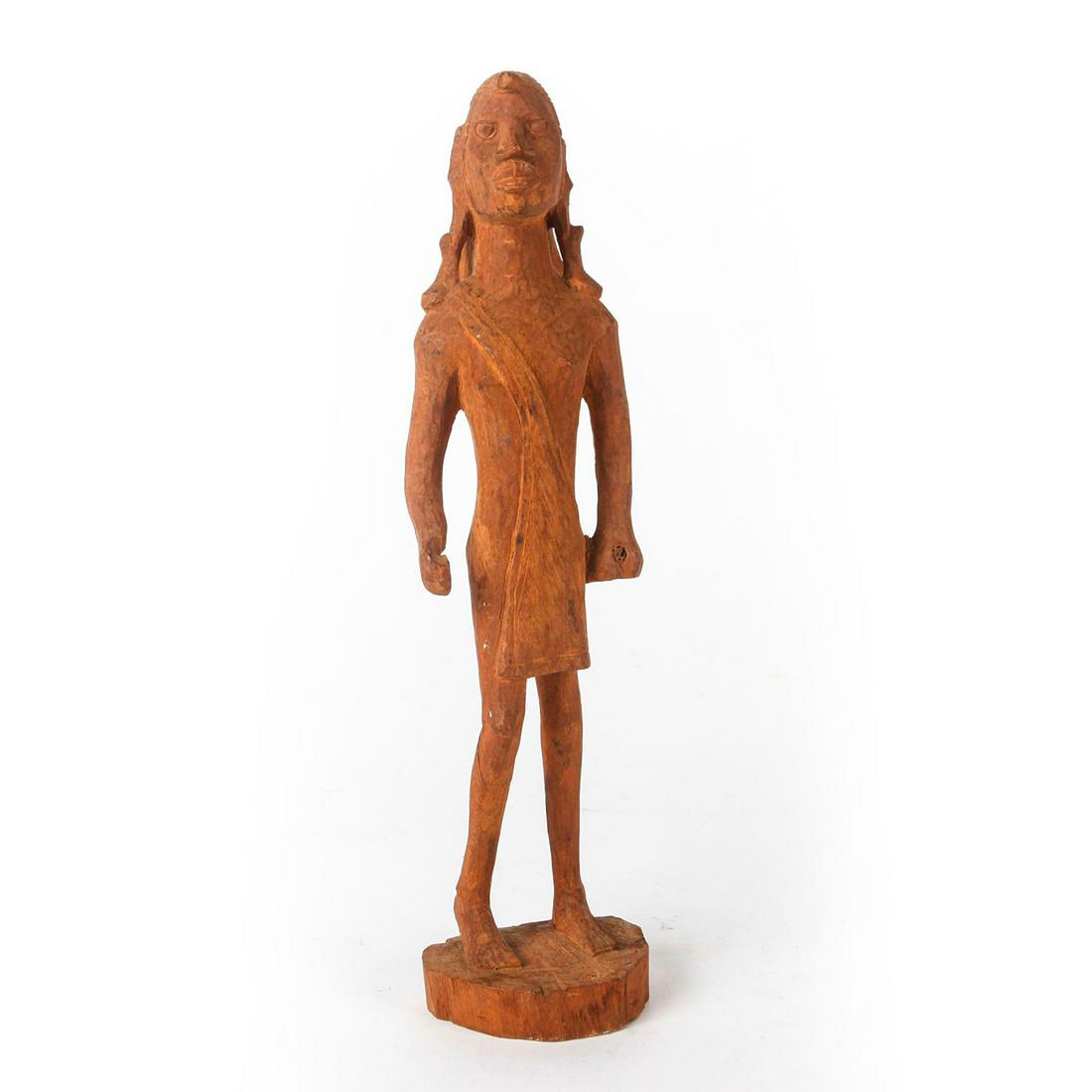 AFRICAN WOODEN HAND CARVED FIGURE, MAN STANDING: Carved figure of a man standing barefoot. He wears a headdress and has elongated earlobes. He holds a piece of a weapon that has been broken. Issued: 20th c. Dimensions: 12.5"H Country of Origin: Afri