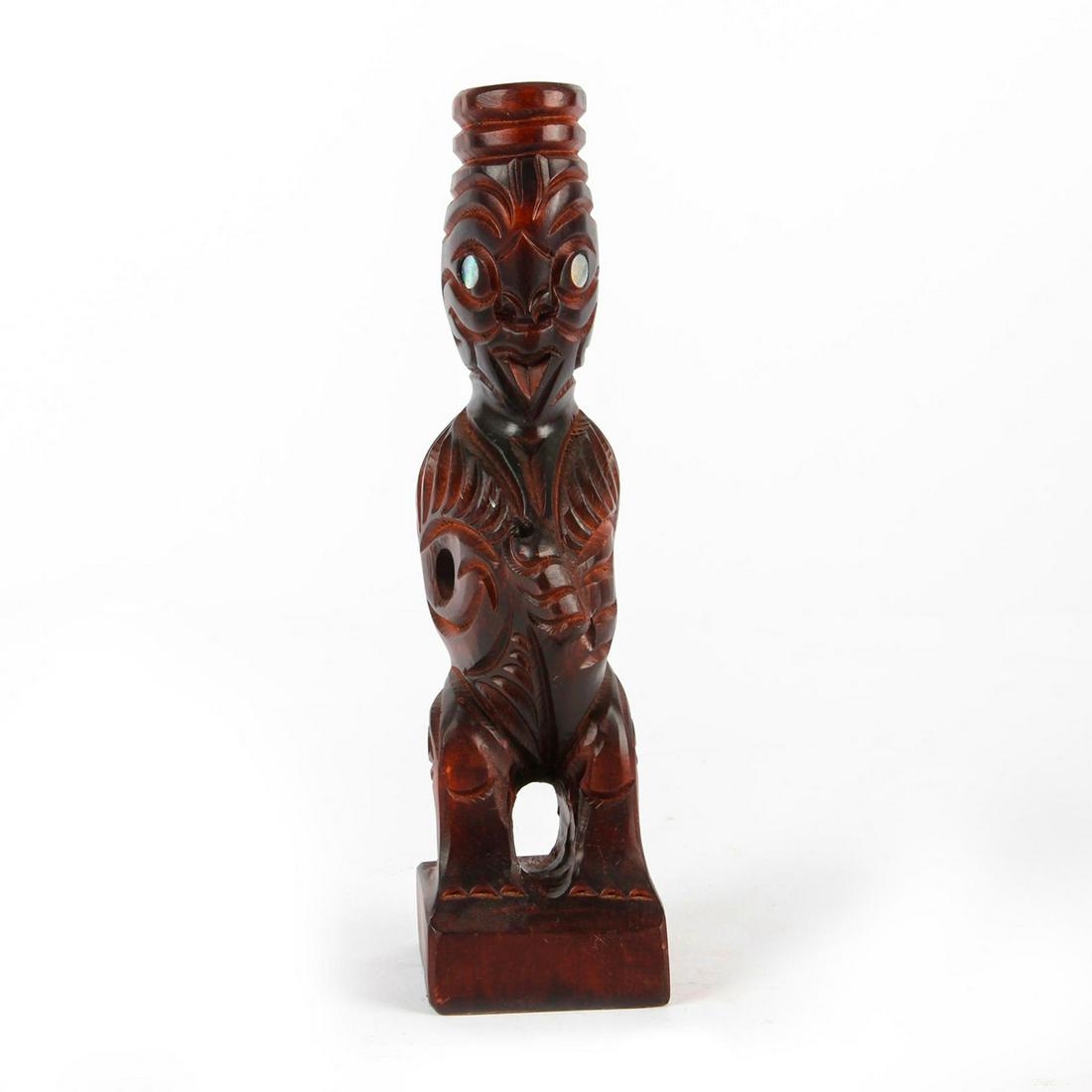 MAORI HAND CARVED WOOD FIGURE WITH PAUA SHELL EYES: Striking hand carved wood figure with paua shell eyes. Issued: 20th c. Dimensions: 10.25"H Country of Origin: New Zealand