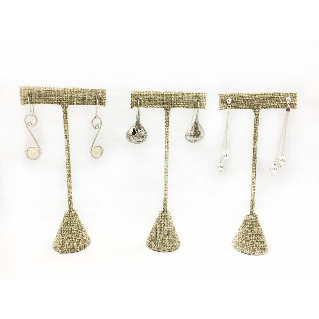 3 PAIRS SILVER PLATED EARRINGS: Three pairs of fun dangle earrings. Pair with white ball at the bottom 2"L. Pair with 2 dangle balls 2.5"L. Pair with engraved design 1.75"L. Issued: 20th c. Provenance: David Farin Collection