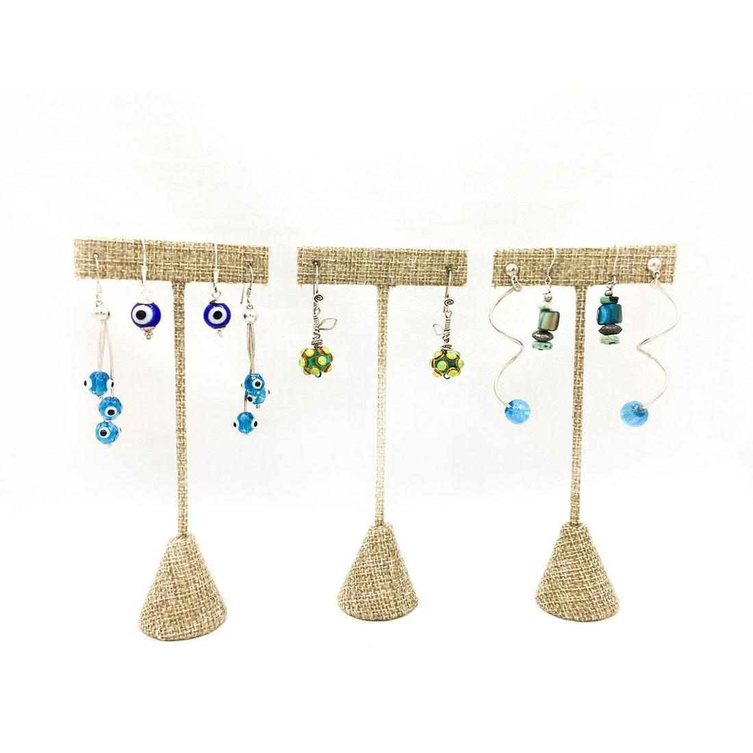 FIVE PAIRS EARRINGS, FOUR GLASS, ONE STONES: Unusual group of glass eye, bubble and stone designs. The lengths are 1.25"L, 1.75"L, 1.5"L, 2.5"L and 2.5"L. The total weight is 25.8g. Issued: 20th c. Provenance: David Farin Collection