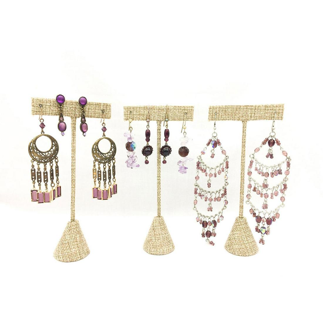 FIVE PAIRS EARRINGS, PURPLE BEADS AND GLASS: Five pairs of charming earrings with purple stones and beads. The lengths are 1.25"L, 2.25"L, 2.25"L, 3"L and 5.5"L. The total weight is 44.3g. Issued: 20th c. Provenance: David Farin Collection