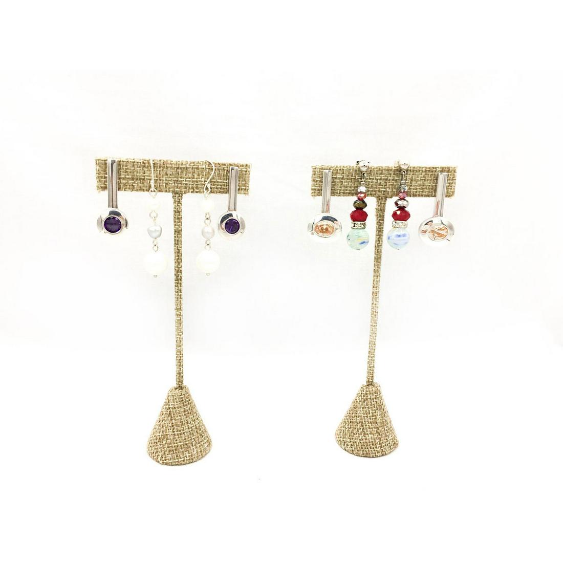 FOUR PAIRS OF SILVER AND BEADED EARRINGS: 2 silver plated earrings with sparkling stones, 2 beaded pair. The lengths are 1.25"L, 1.25"L, 1.5"L, 2"L and "L. The total weight is 30.4g. Issued: 20th c. Provenance: David Farin Collection
