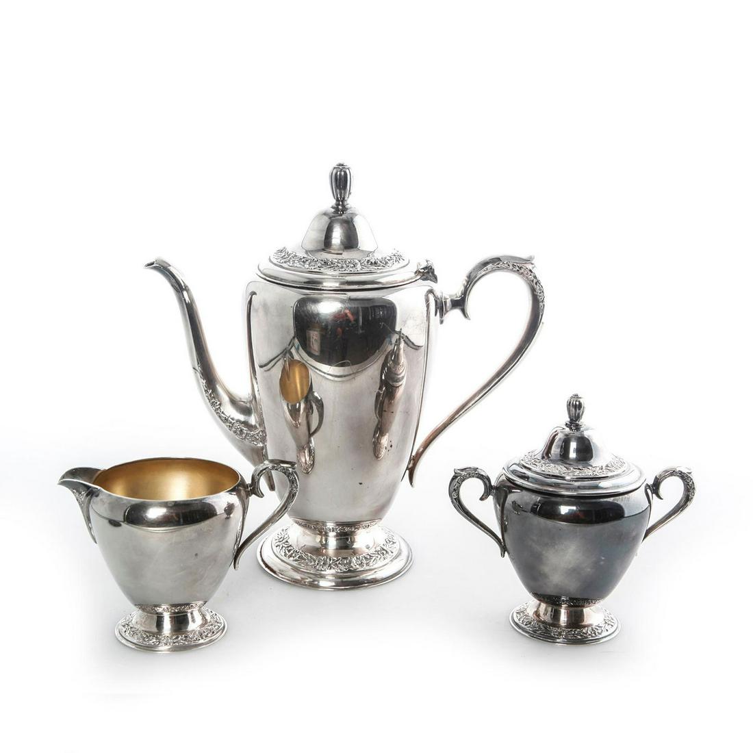 STERLING SILVER COFFEE AND TEA SERVICE: Includes creamer and sugar containers. Primrose backstamp. Issued: 20th C. Dimensions: 10"T Largest Manufacturer: Primrose WmRogers & Son