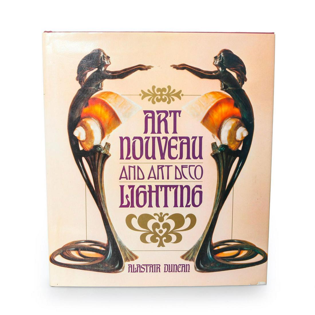 ART NOUVEAU AND ART DECO LIGHTING BOOK BY ALASTAIR: Lamp design of bronze, ceramics and stained glass. Artist: Alasrair Duncan Issued: 1978 Dimensions: 10.5" L Manufacturer: Simon and Schuster Country of Origin: United States