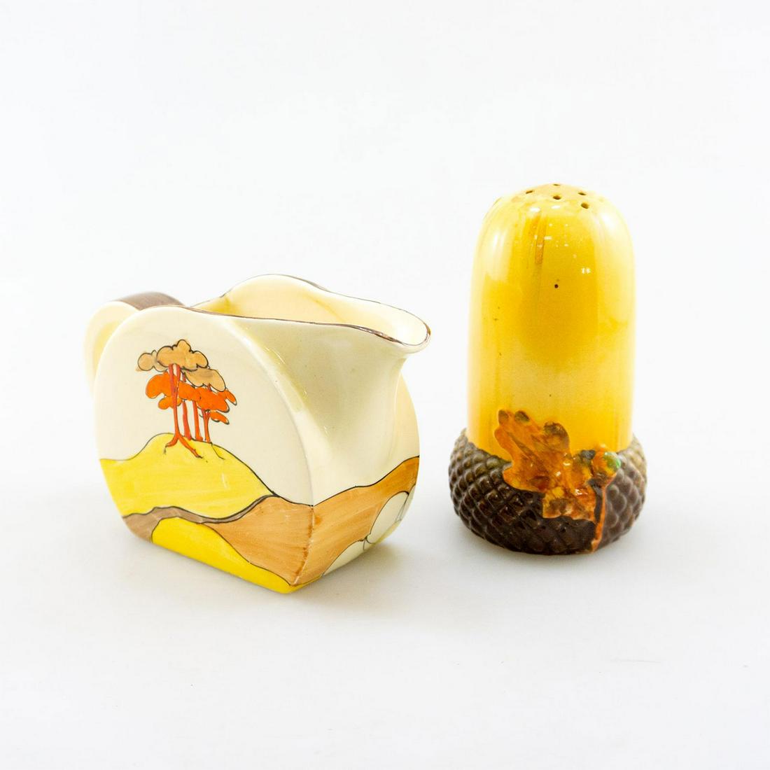 2 ENGLISH CERAMICS; 1 CREAMER, 1 PEPPER SHAKER CLARICE: Bizarre Ware Clarice Cliff creamer; Coral Firs pattern and 1 shaker. Company backstamp. Dimensions: 5"H, tallest Manufacturer: Clarice Cliff, other Country of Origin: England