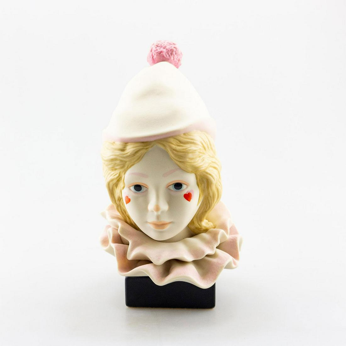 CYBIS PORCELAIN BUST SCULPTURE, FUNNY FACE CIRCUS CLOWN: Bisque ceramic girl, pink. Mounted on black metal base. #CybisPorcelain #AmericanPorcelain #Ceramics #DecorativeArts #Sculpture Issued: 1976 Dimensions: 10"H x 5.25"W Manufacturer: Cybis Country of Or