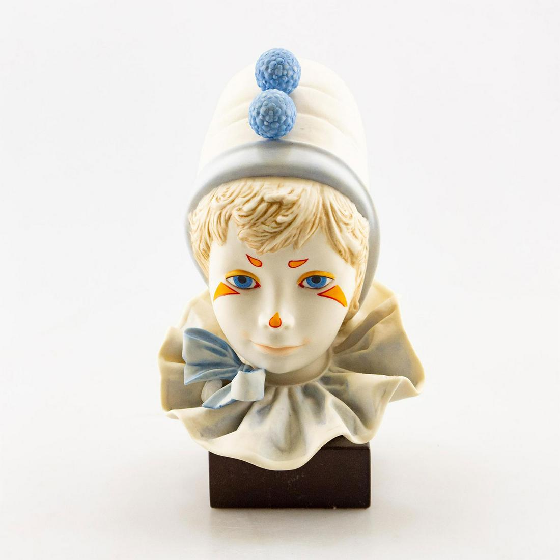 CYBIS PORCELAIN BUST SCULPTURE, FUNNY FACE CIRCUS CLOWN: Bisque ceramic boy, blue. Mounted on black metal base. #CybisPorcelain #AmericanPorcelain #Ceramics #DecorativeArts #Sculpture Issued: 1976 Dimensions: 9.5"H x 5.5"W Manufacturer: Cybis Country of Ori