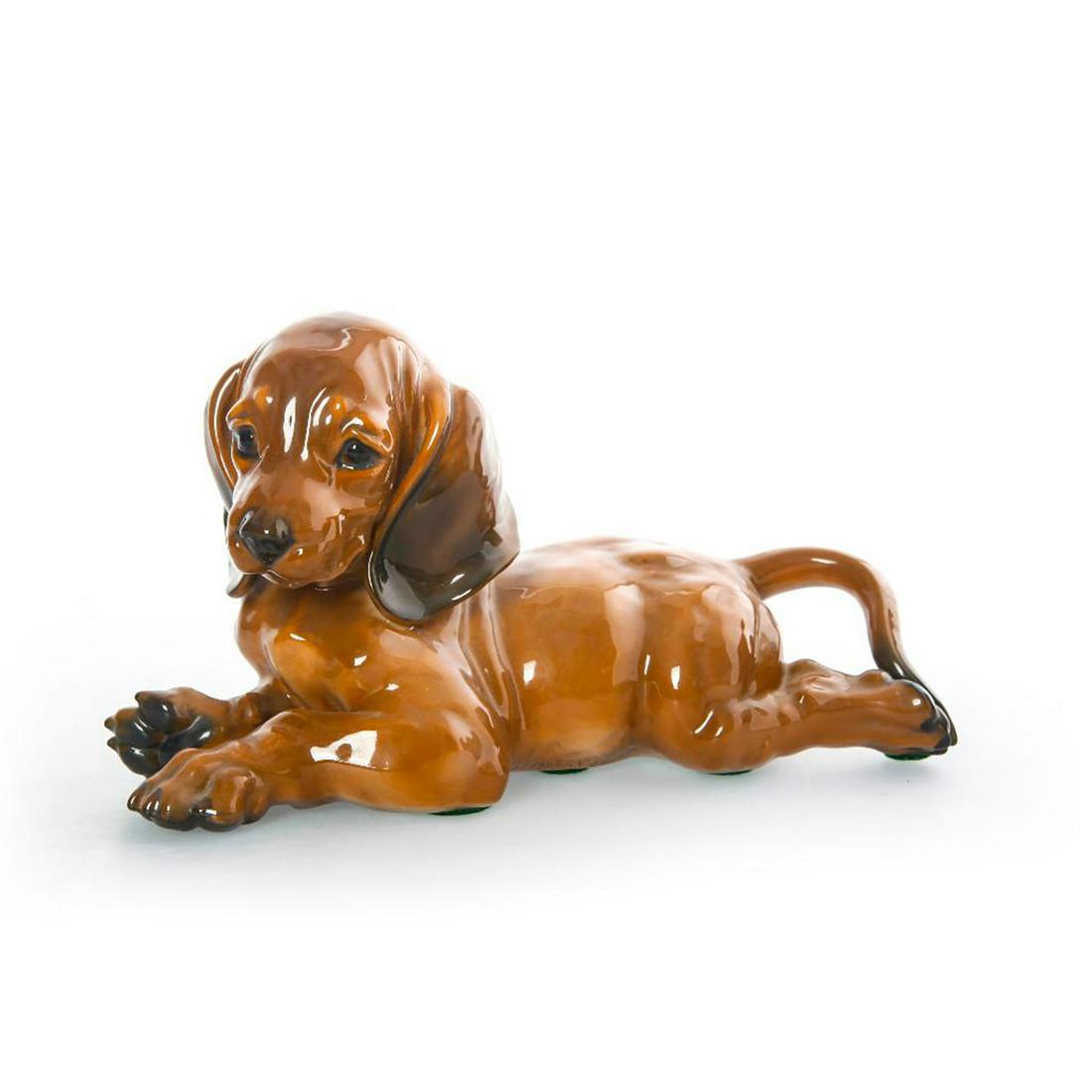 ROSENTHAL ART DECO CERAMIC DACHSHUND PUPPY FIGURINE: Glazed brown and naturalistic colors. Artist signed. #Rosenthal #GermanCeramics #GermanPottery #AnimalFigurines #Dachshund #Puppy Artist: Fritz Heidenreich Issued: c. 1935 Dimensions: 6.5"H x 7"W Manu