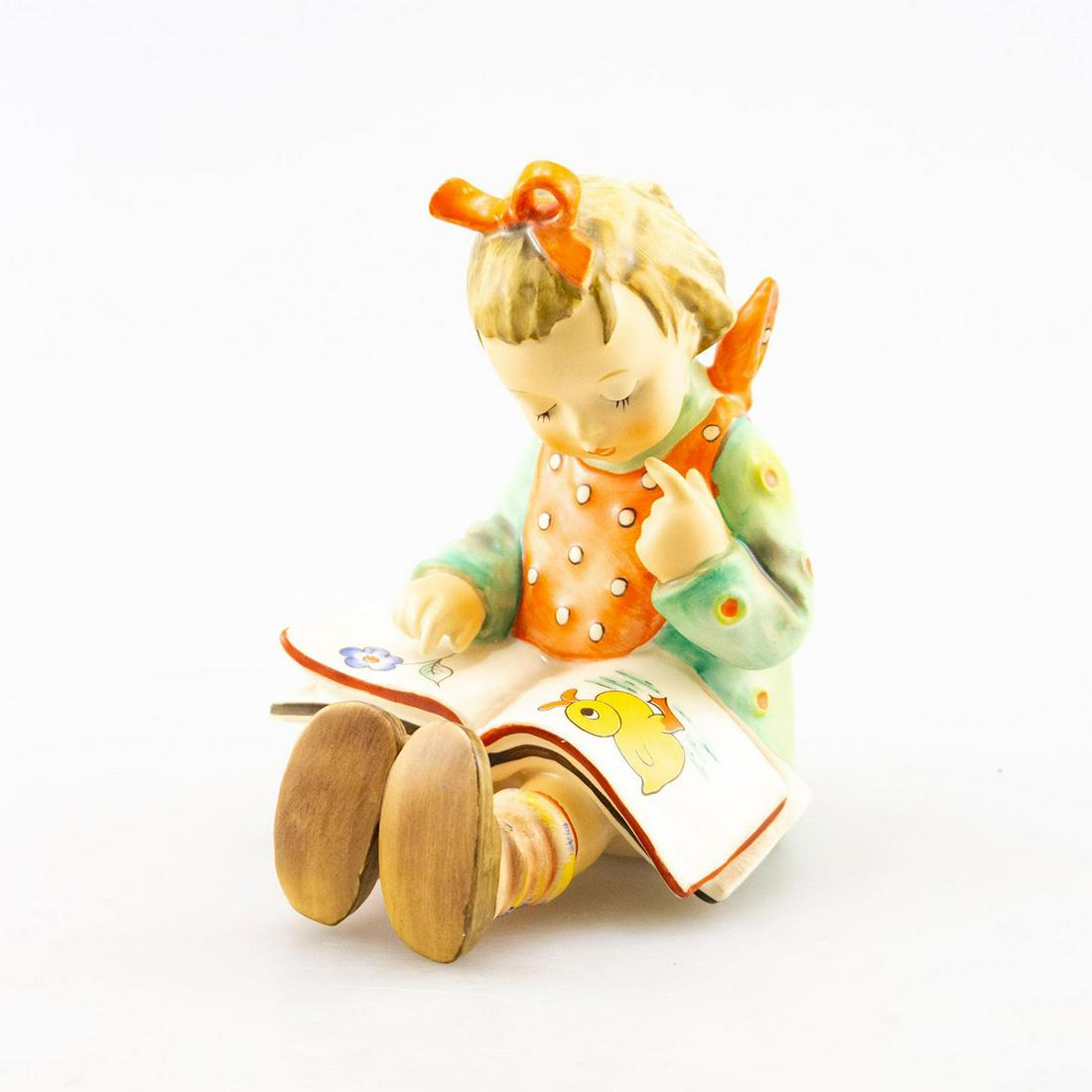 GOEBEL HUMMEL FIGURINE, BOOKWORM GIRL: Handcrafted; hand painted. Young girl reading a book. Goebel backstamp. Issued: 20th c. Dimensions: 5.5"H Manufacturer: Goebel Country of Origin: Germany