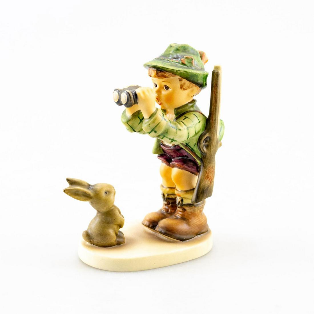 GOEBEL HUMMEL FIGURINE, GOOD HUNTING 307: A boy looks through binoculars while a rabbit watches him. Artist: Goebel Issued: 1955 Dimensions: 5.5"H Manufacturer: Goebel Country of Origin: Germany
