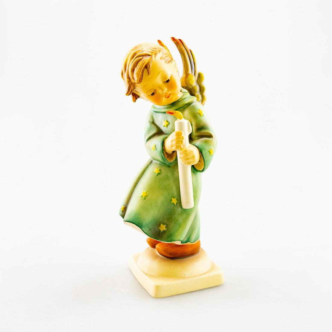 GOEBEL HUMMEL FIGURINE, HEAVENLY ANGEL 21: Angel protecting the candle flame. Goebel backstamp. Issued: 20th C. Dimensions: 8.5" tall Manufacturer: Goebel Country of Origin: Germany