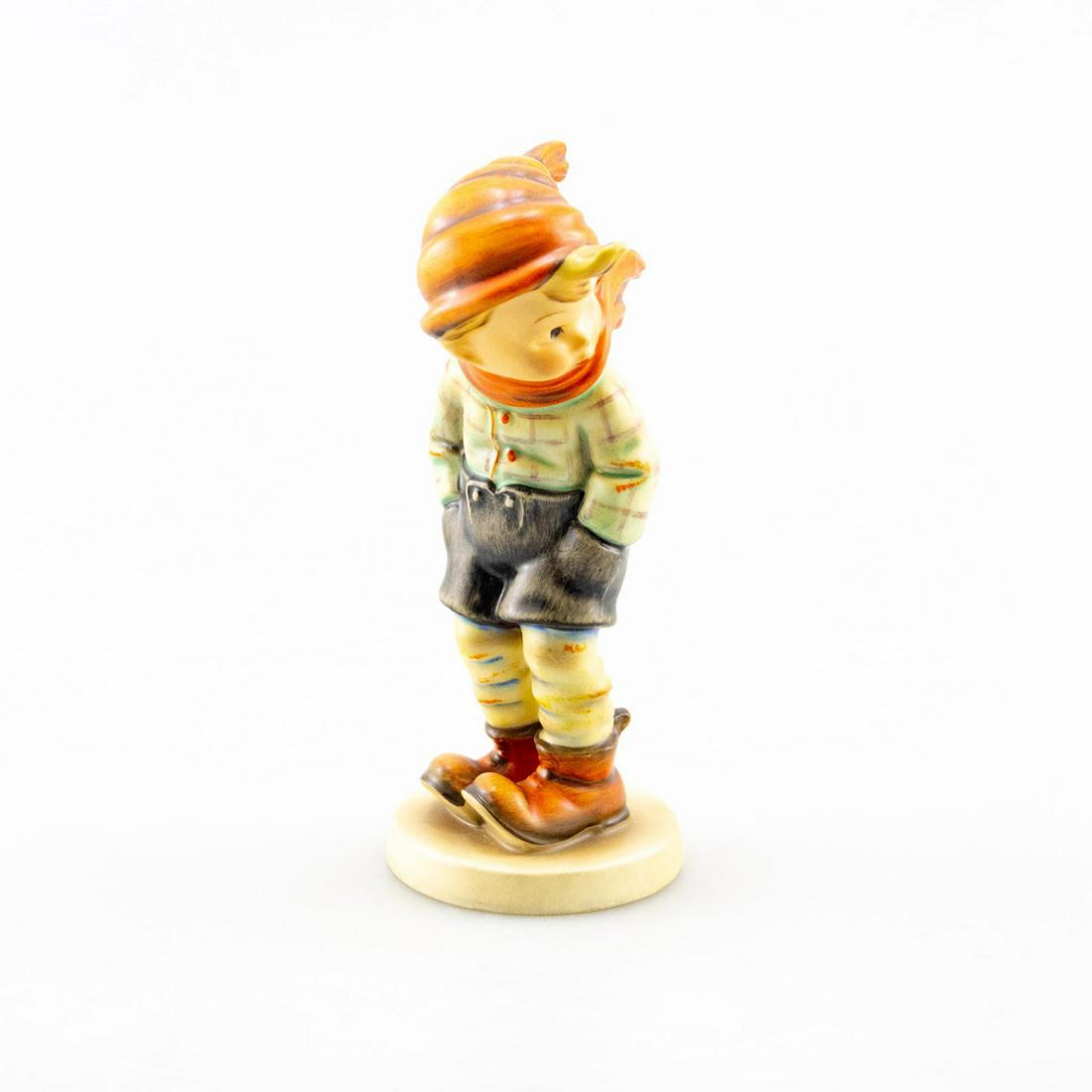 GOEBEL HUMMEL FIGURINE, MARCH WINDS 43: A boy stands with his scarf blowing bracing the wind. Artist: Goebel Issued: 20th c. Dimensions: 4.75" Manufacturer: Goebel Country of Origin: Germany