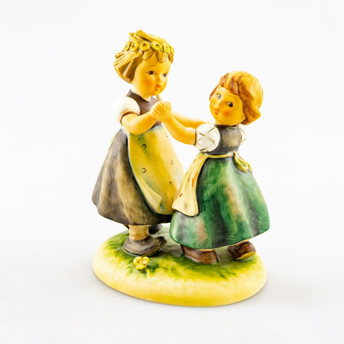 GOEBEL HUMMEL FIGURINE, SPRING DANCE 353: Dancing in the meadows. Goebel backstamp. Issued: 20th C. Dimensions: 7" tall Manufacturer: Goebel Country of Origin: Germany
