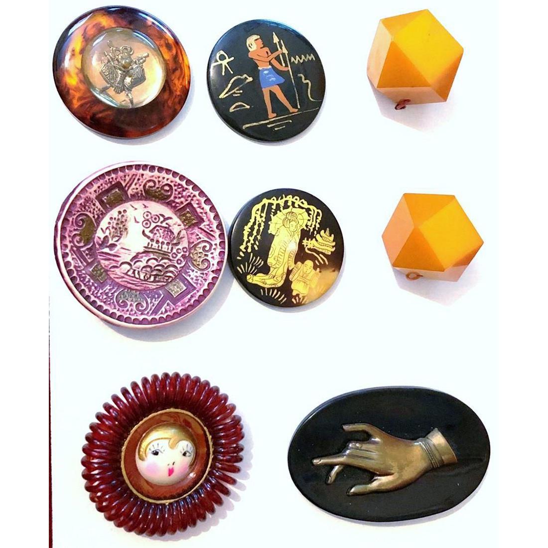 EIGHT ASSORTED DIVISION THREE PLASTIC BUTTONS: 8 Medium and large various design buttons in various plastics. This lot includes two faceted ball shaped butterscotch Bakelite, two large Casein wafers with figural designs, a large Flapper center han