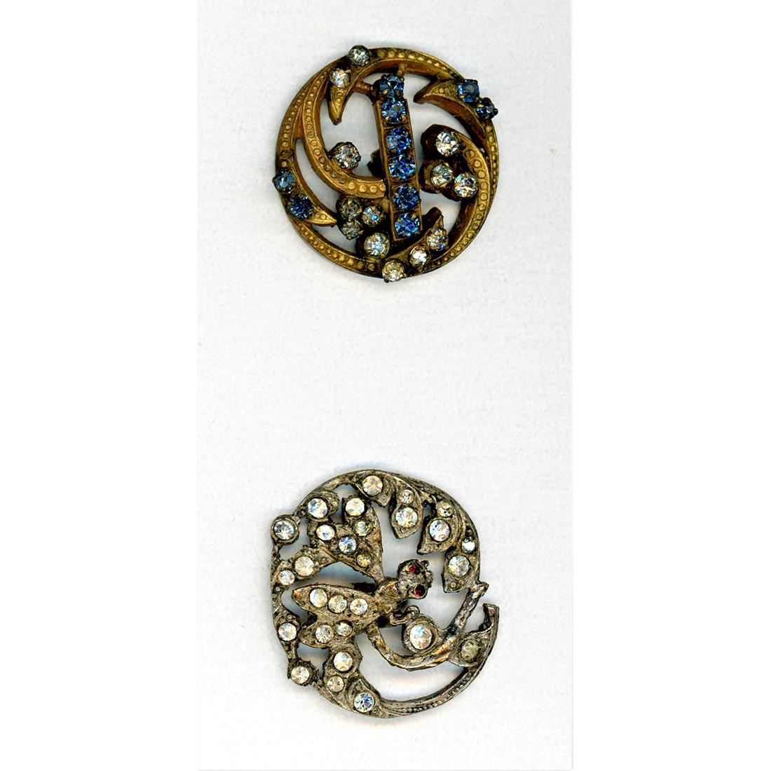 TWO DIVISION ONE ALL OVER PASTE PIERCED BUTTONS: 2 medium and large paste jewel buttons including a dragonfly. The dragonfly is done in silver and has red paste eyes, beautiful example of 19th century paste jewel buttons. The other medium example in