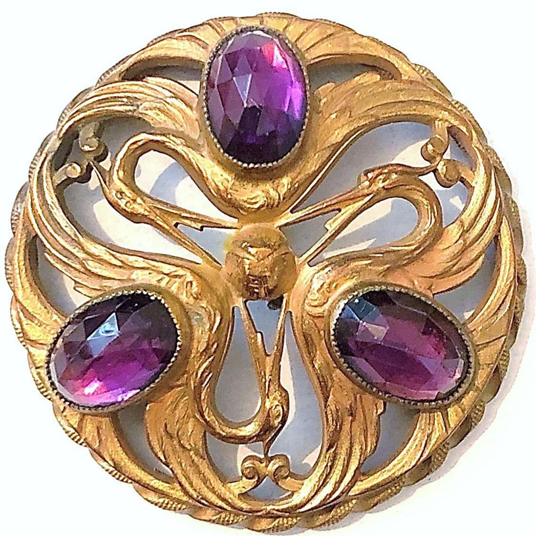 A LARGE PIERCED BRASS AMETHYST JEWEL BUTTON: This 19th C. button certainly expresses the Art Nouveau movement. Enhanced with three oval amethyst jewels on this pierced and gilded brass button you can see in the images that this example would be 