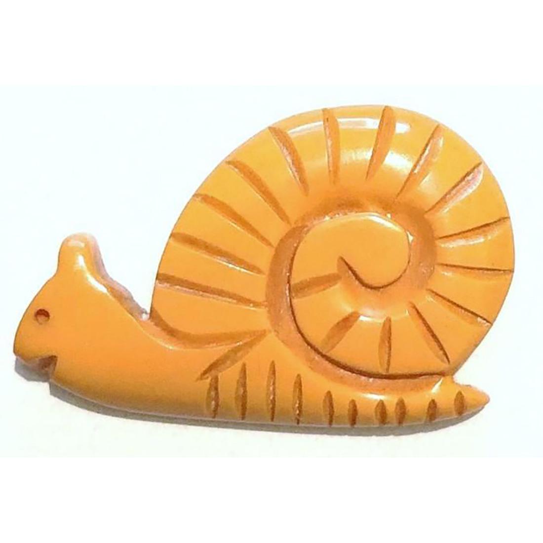 ONE DIVISION 3 REALISTIC CHUNKY BAKELITE BUTTON SNAIL: 1 large carved realistic shape snail in butterscotch Bakelite. Bakelite was first patented in 1907 by Leo Baekaland. These chunky realistic Bakelite buttons are always whimsical and fun.